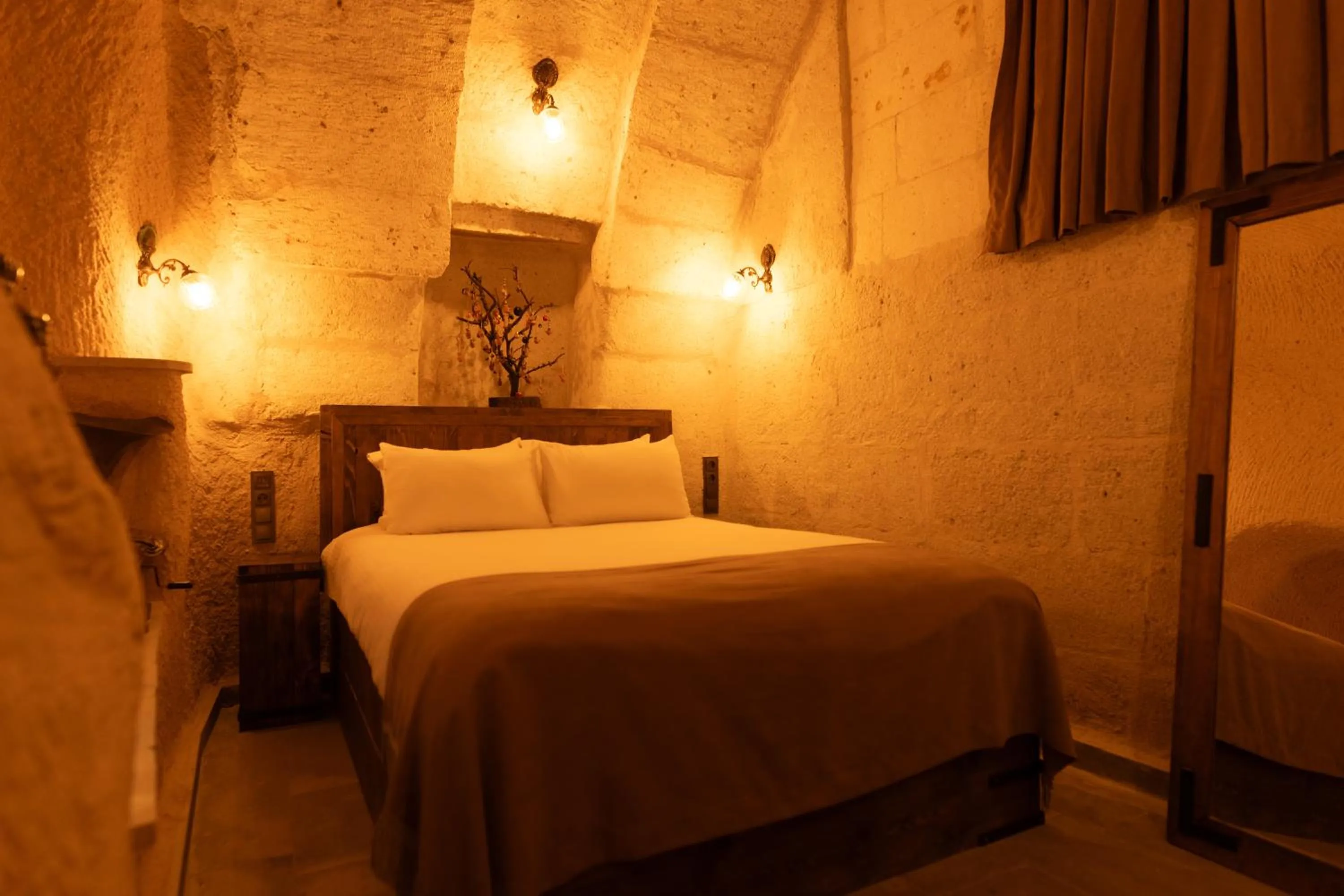 Bed in Lemon Cave Suites