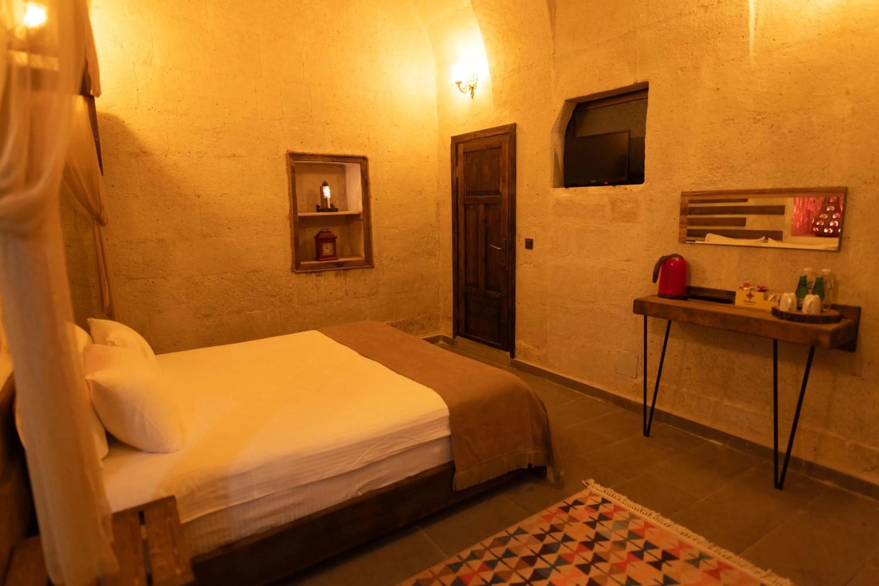 Bed in Lemon Cave Suites