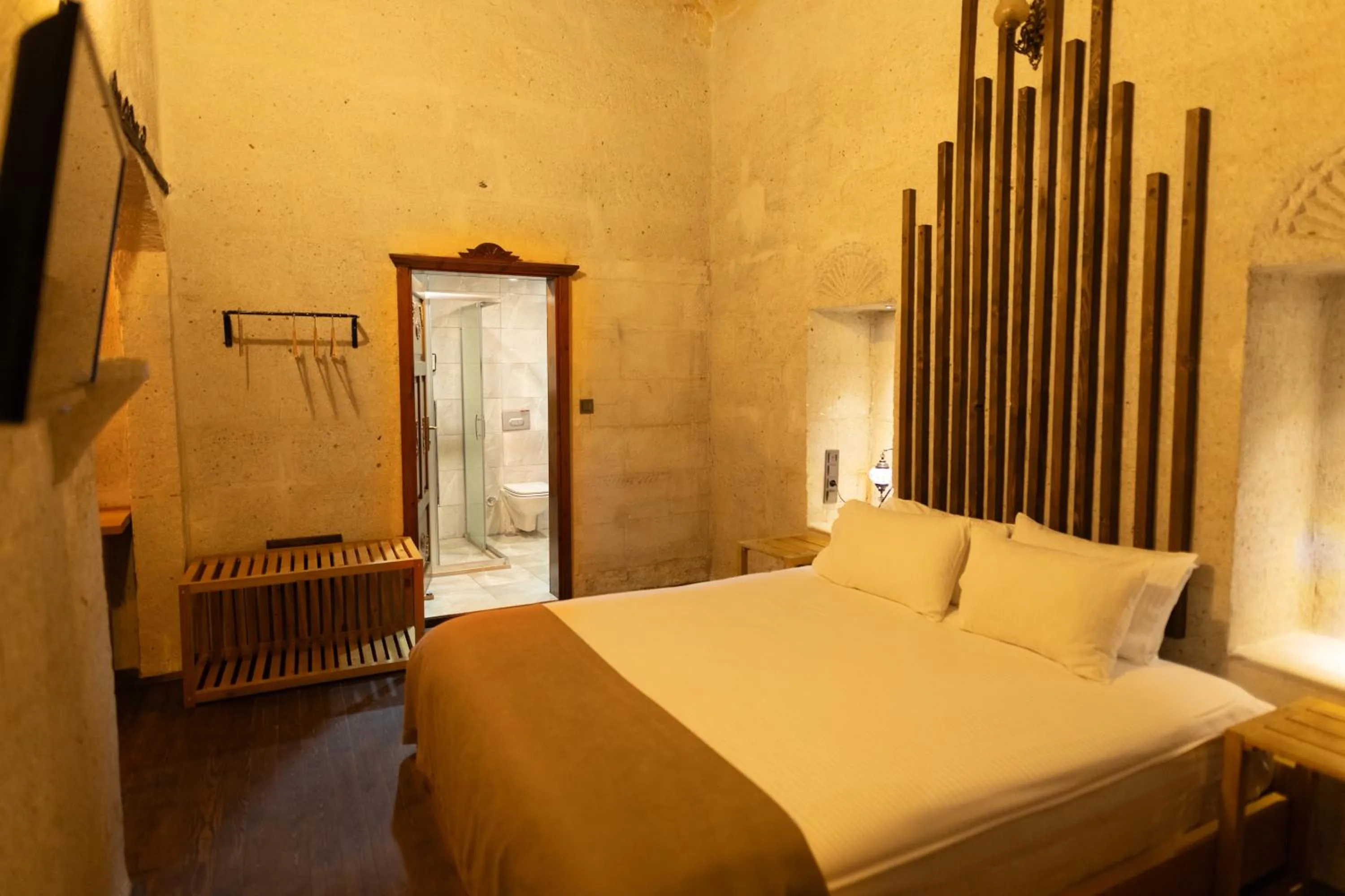 Bed in Lemon Cave Suites