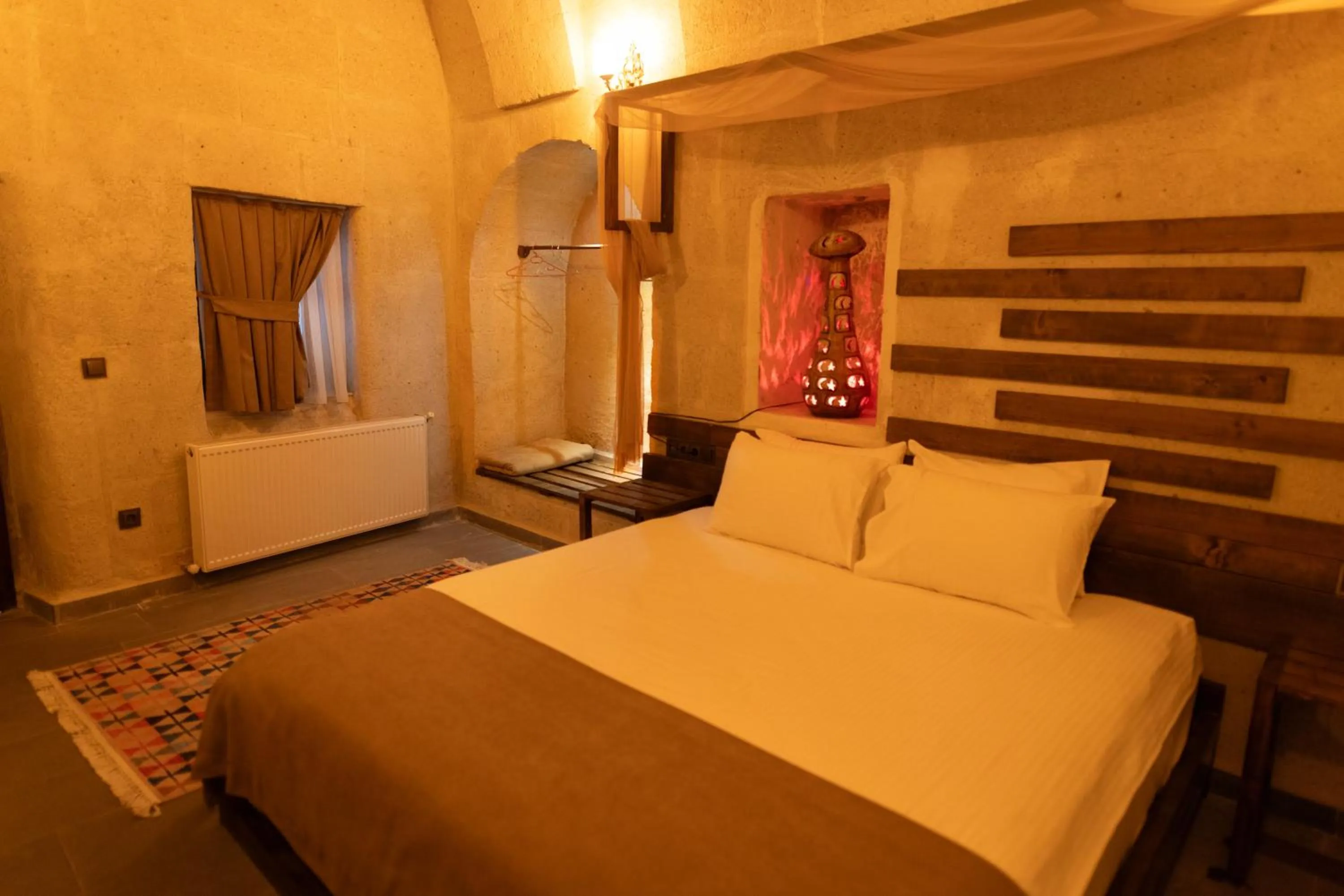 Bed in Lemon Cave Suites
