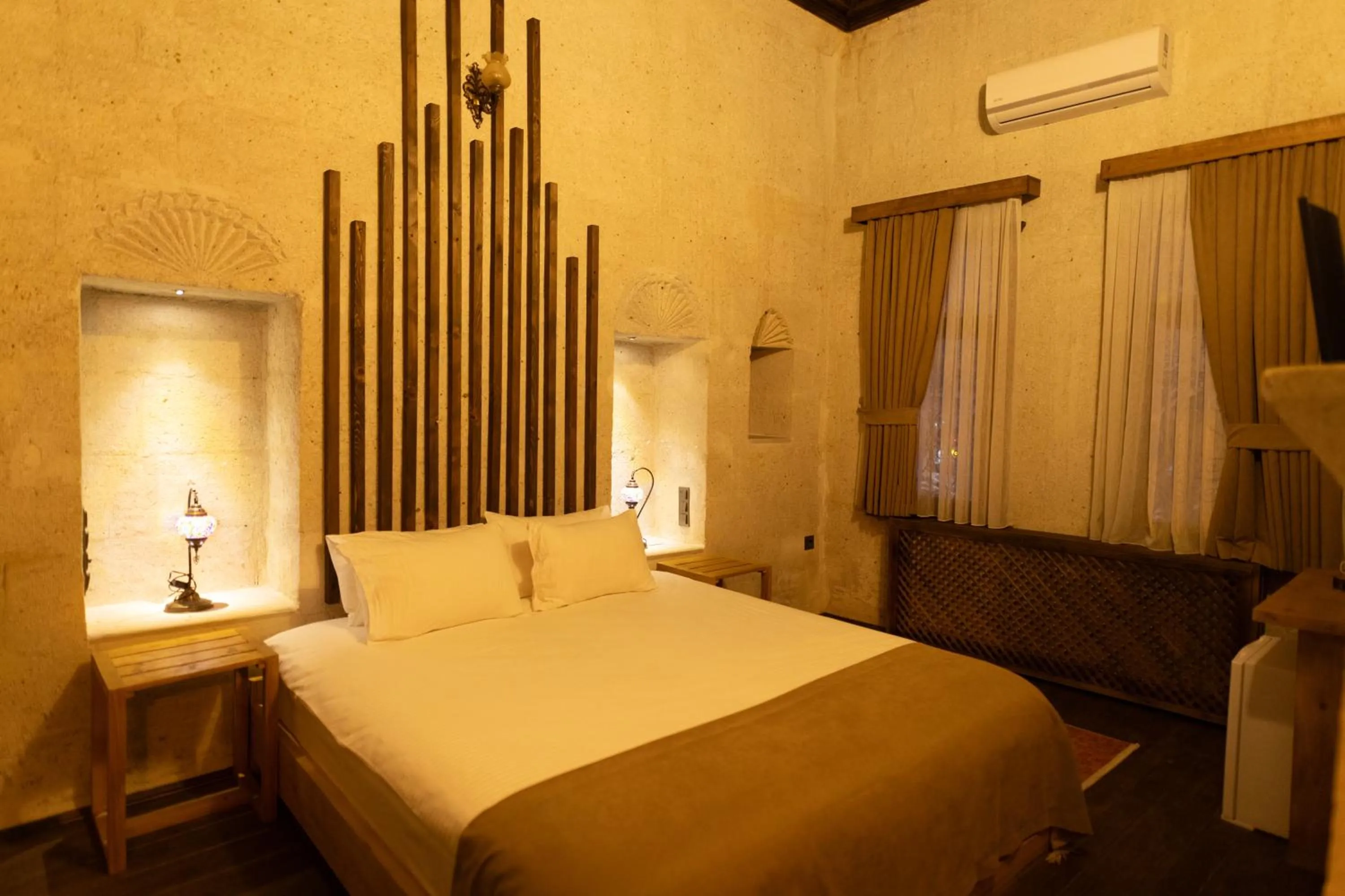 Bed in Lemon Cave Suites