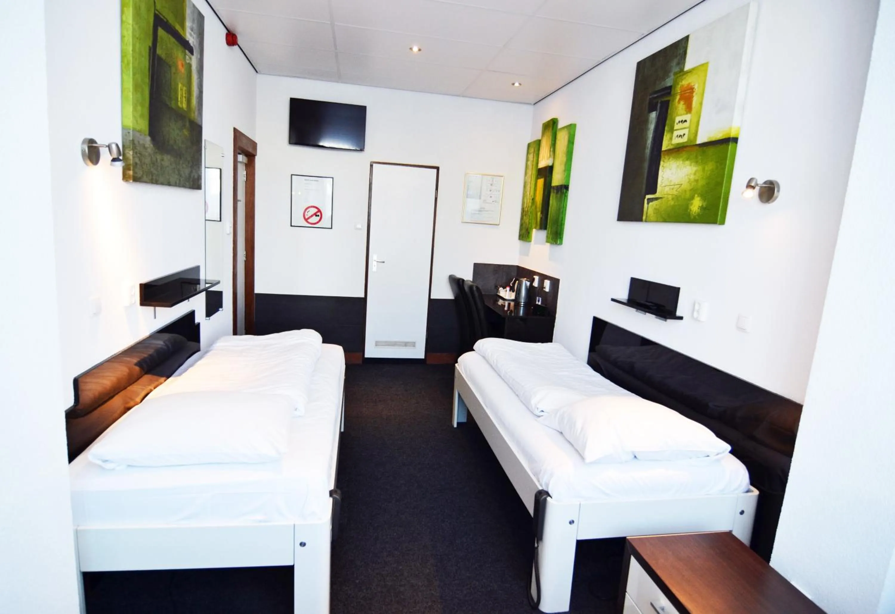 Bed in Hotel Bienvenue