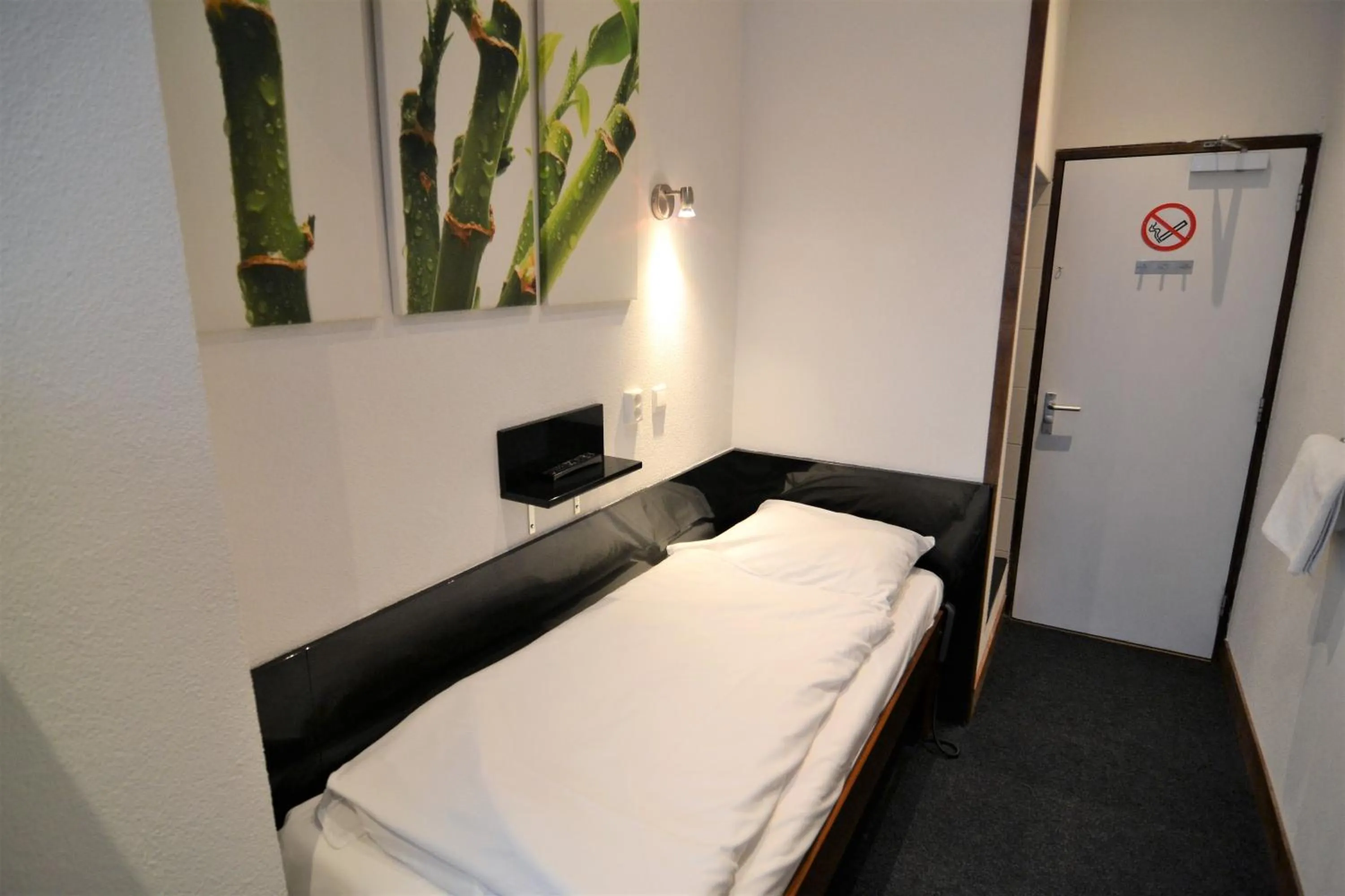 Bed in Hotel Bienvenue