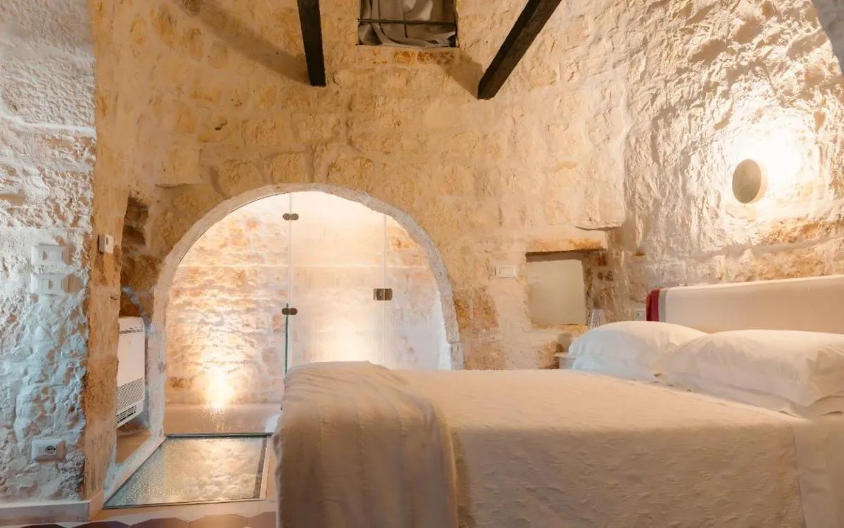 Bed in Leonardo Trulli Resort