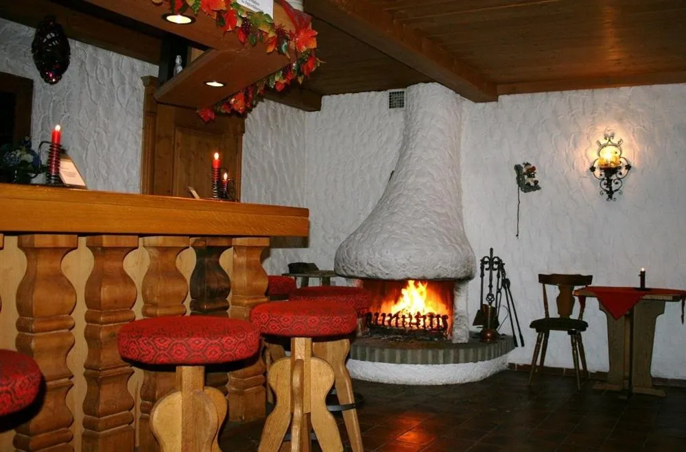 fireplace in Hotel Alp Inn - Chiemgaukarte inclusive