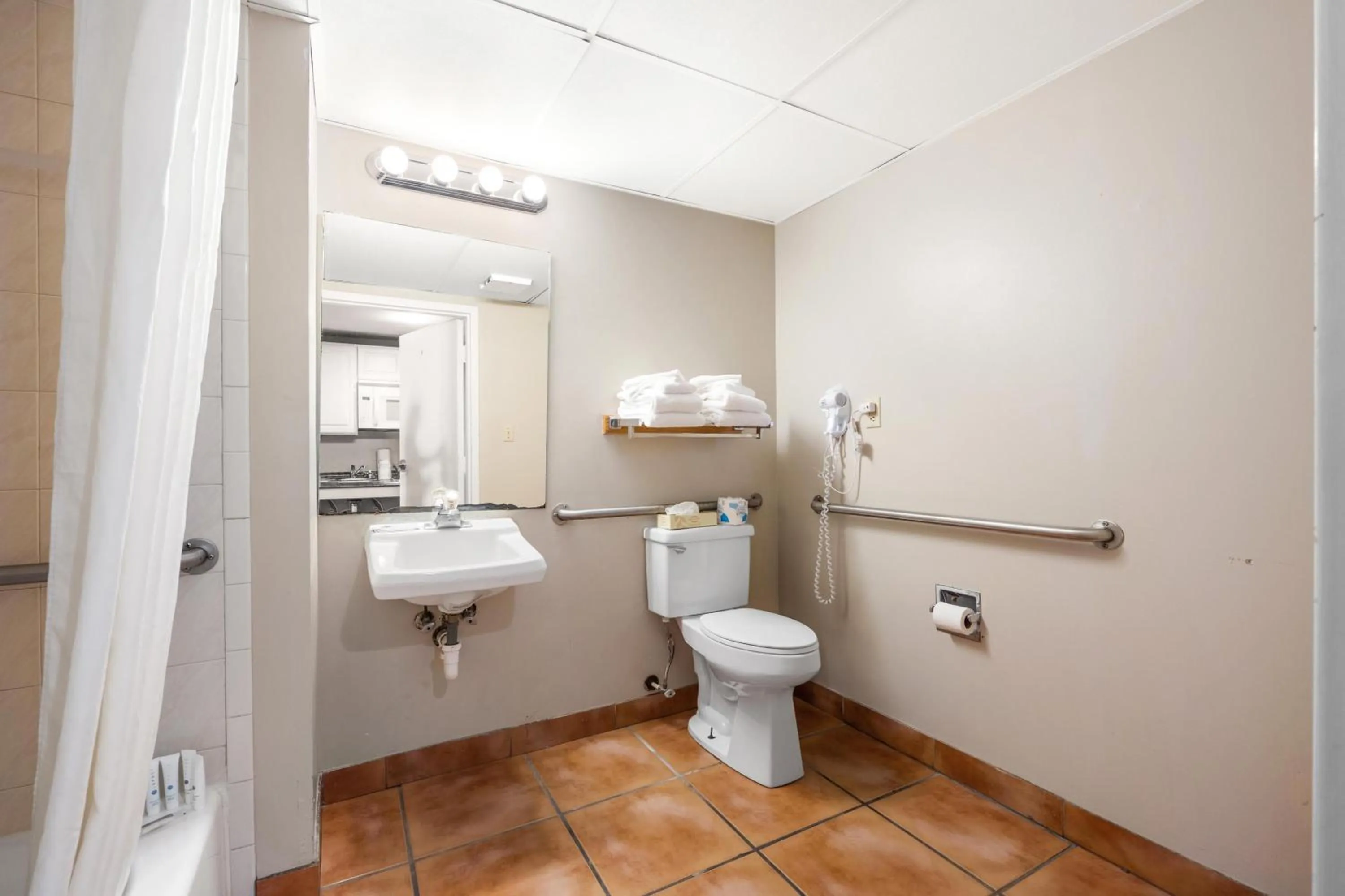 Toilet in Tidelands Caribbean Boardwalk Hotel and Suites