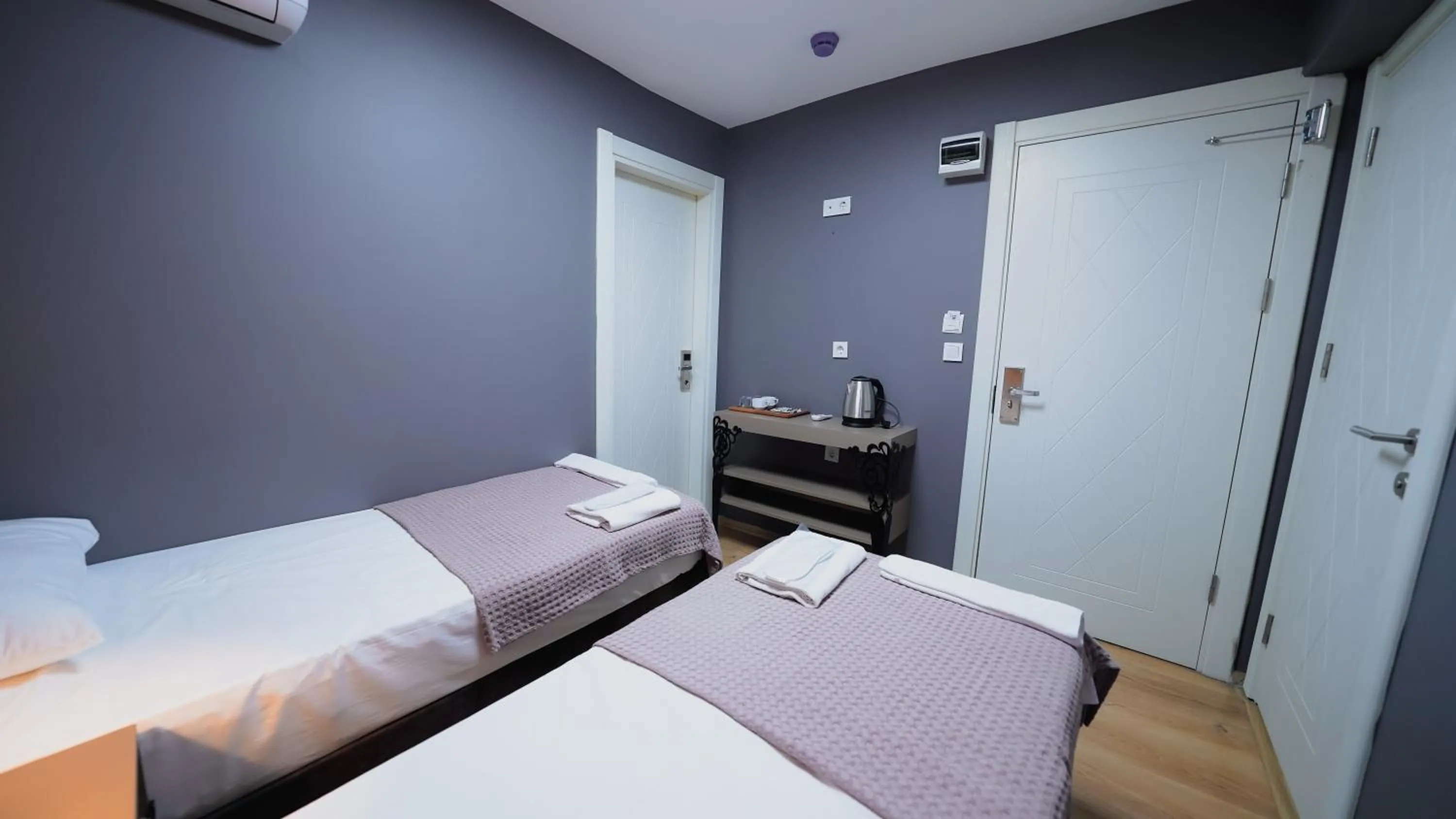 Bed in Luka Suit Hotel