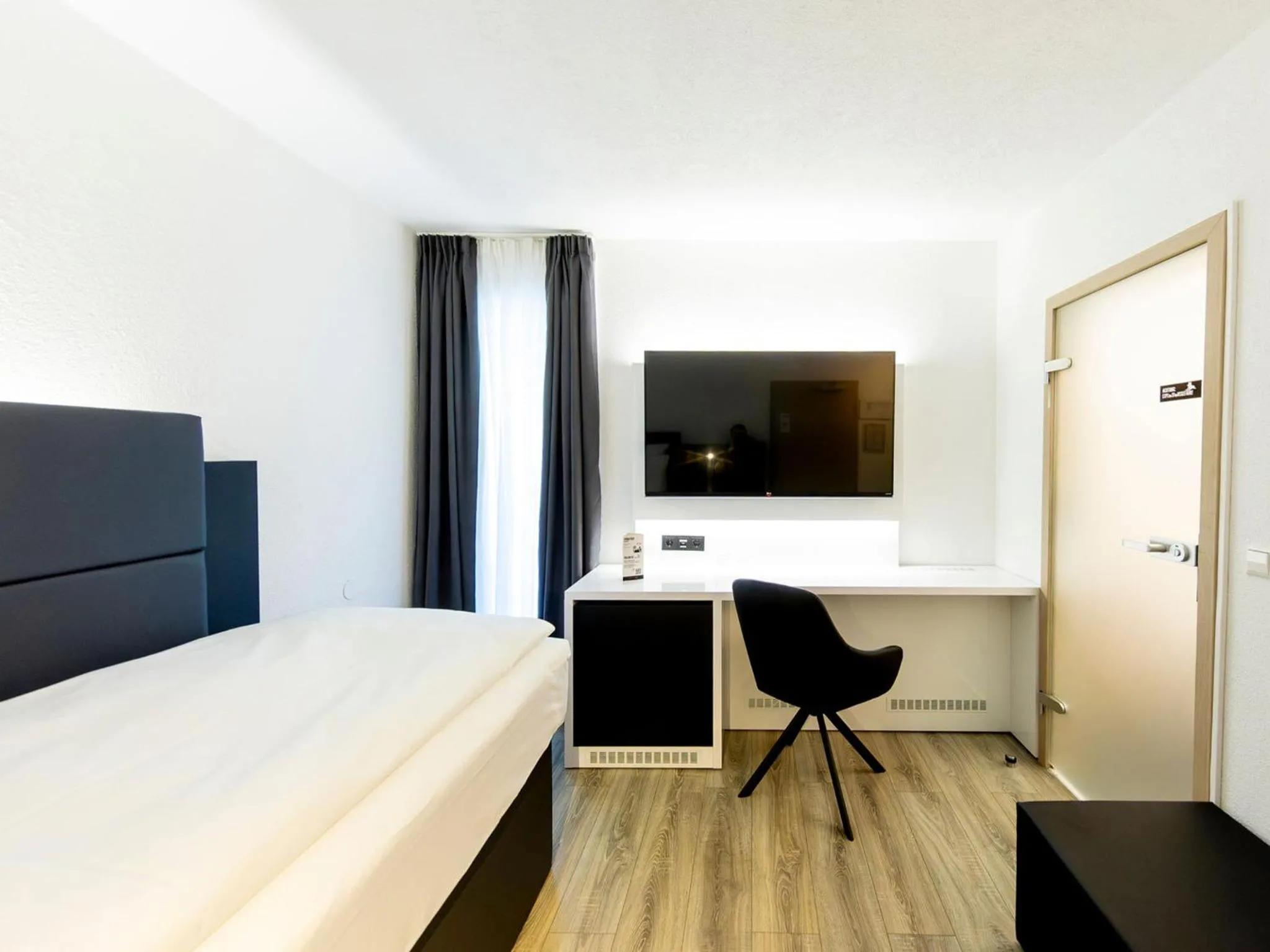 Photo of the whole room, Bed in DORMERO Hotel Aalen