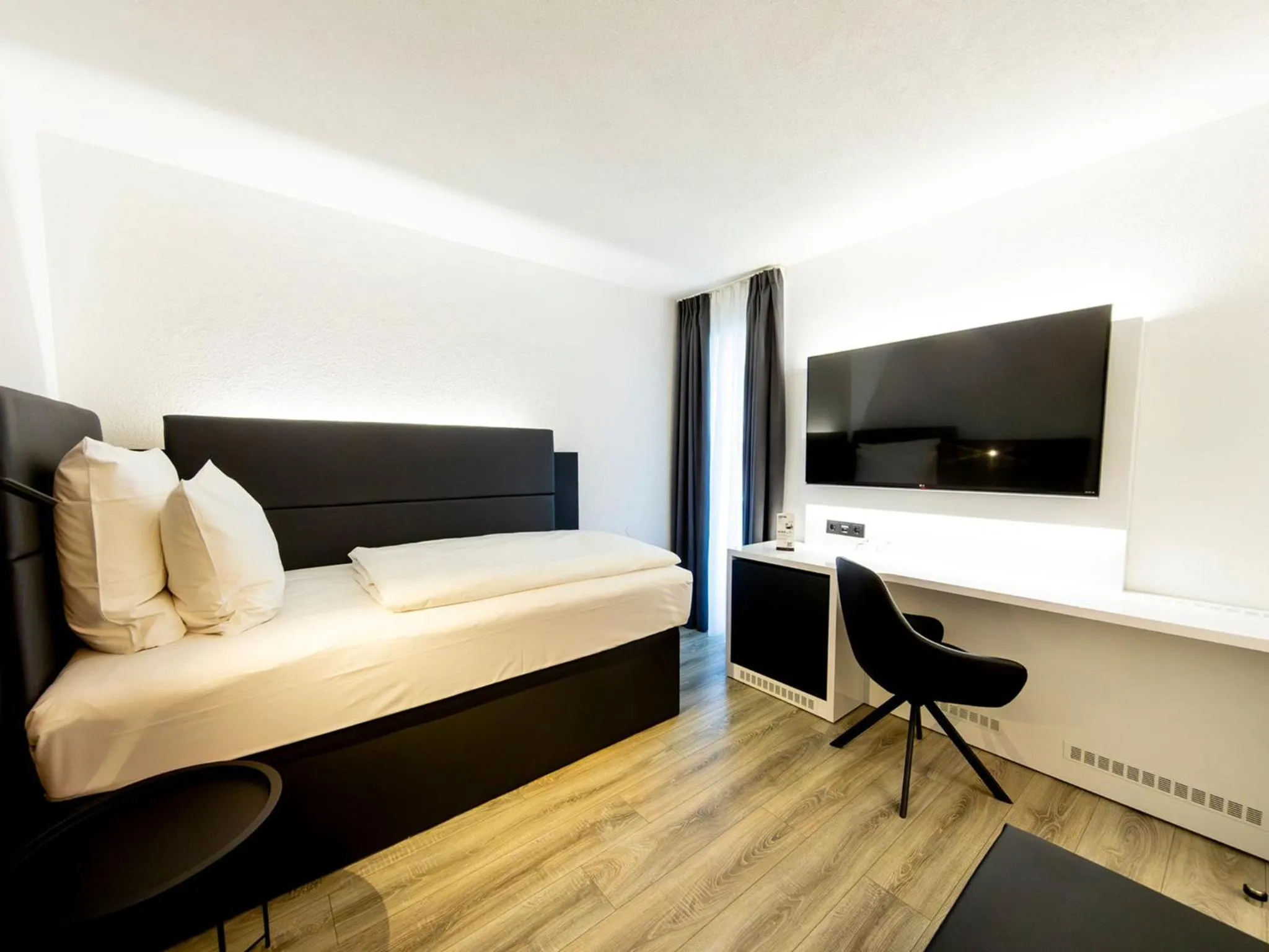 Photo of the whole room, Bed in DORMERO Hotel Aalen