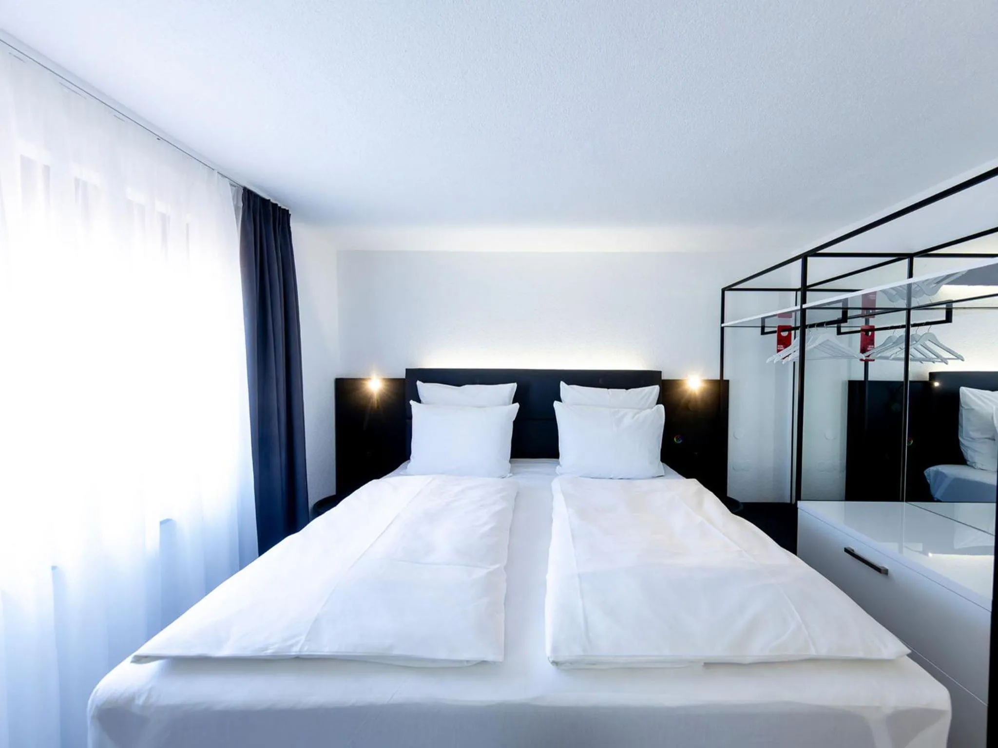Photo of the whole room, Bed in DORMERO Hotel Aalen