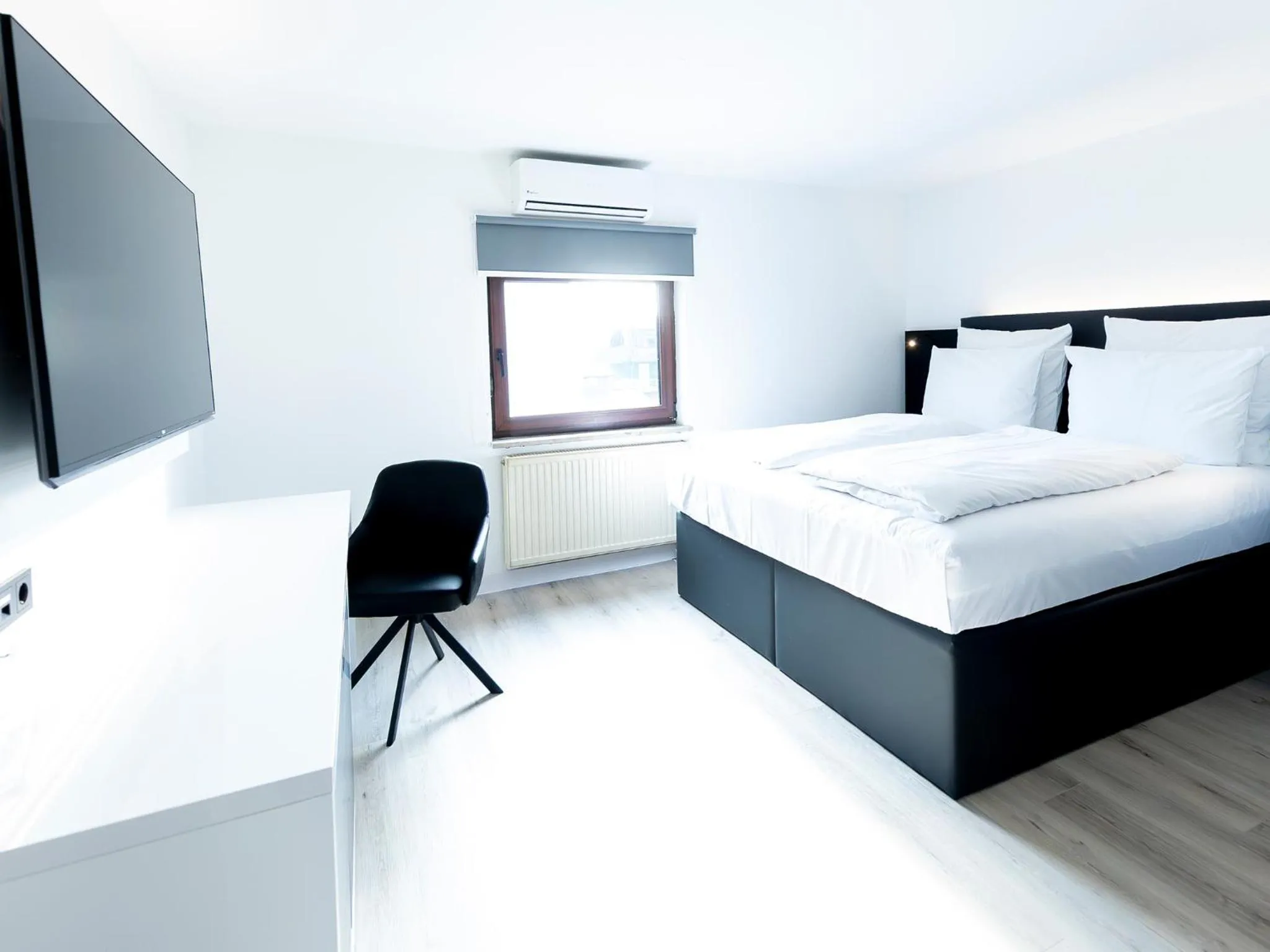 Photo of the whole room, Bed in DORMERO Hotel Aalen