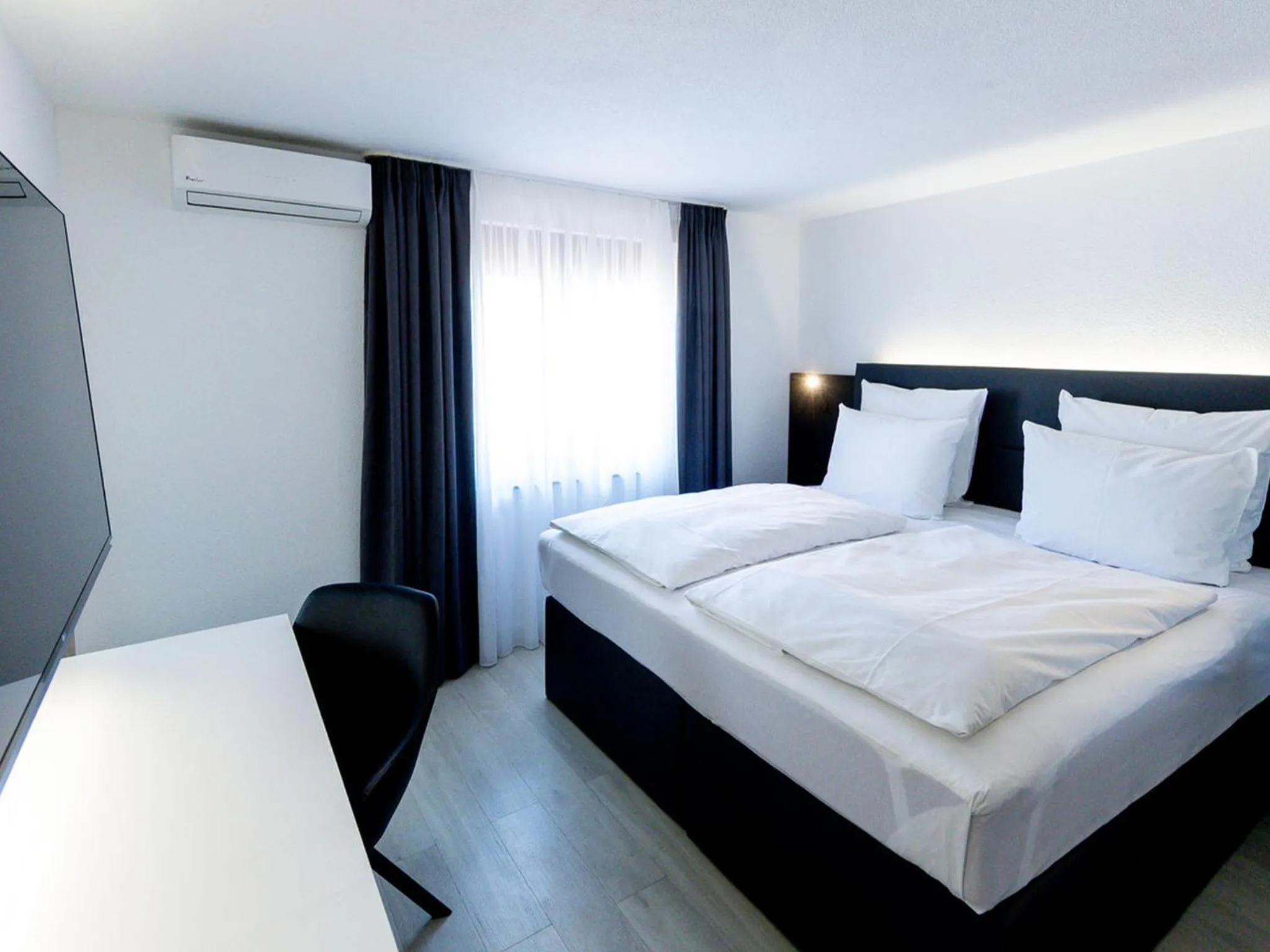 Photo of the whole room, Bed in DORMERO Hotel Aalen