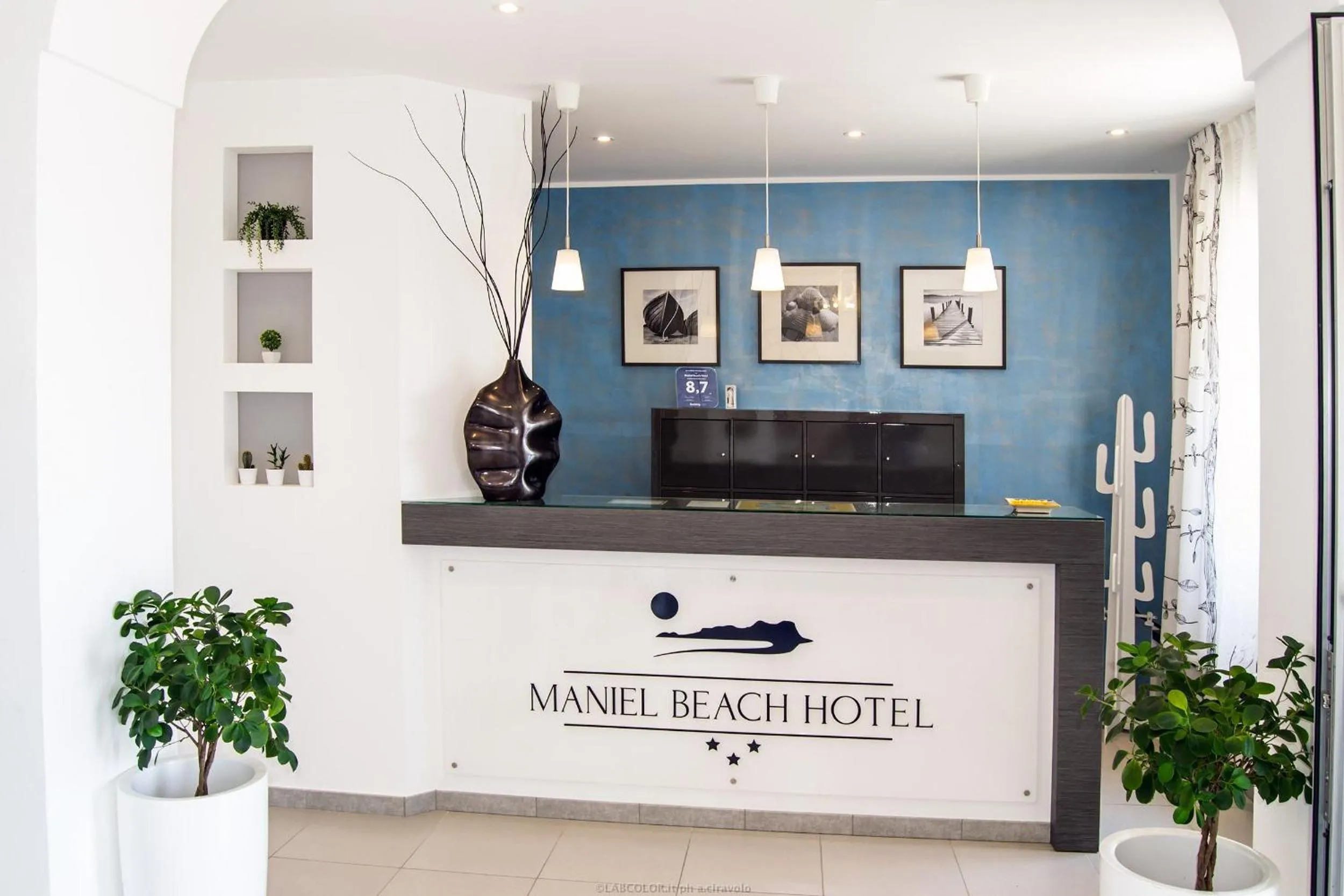 Property logo or sign in Maniel Beach Hotel