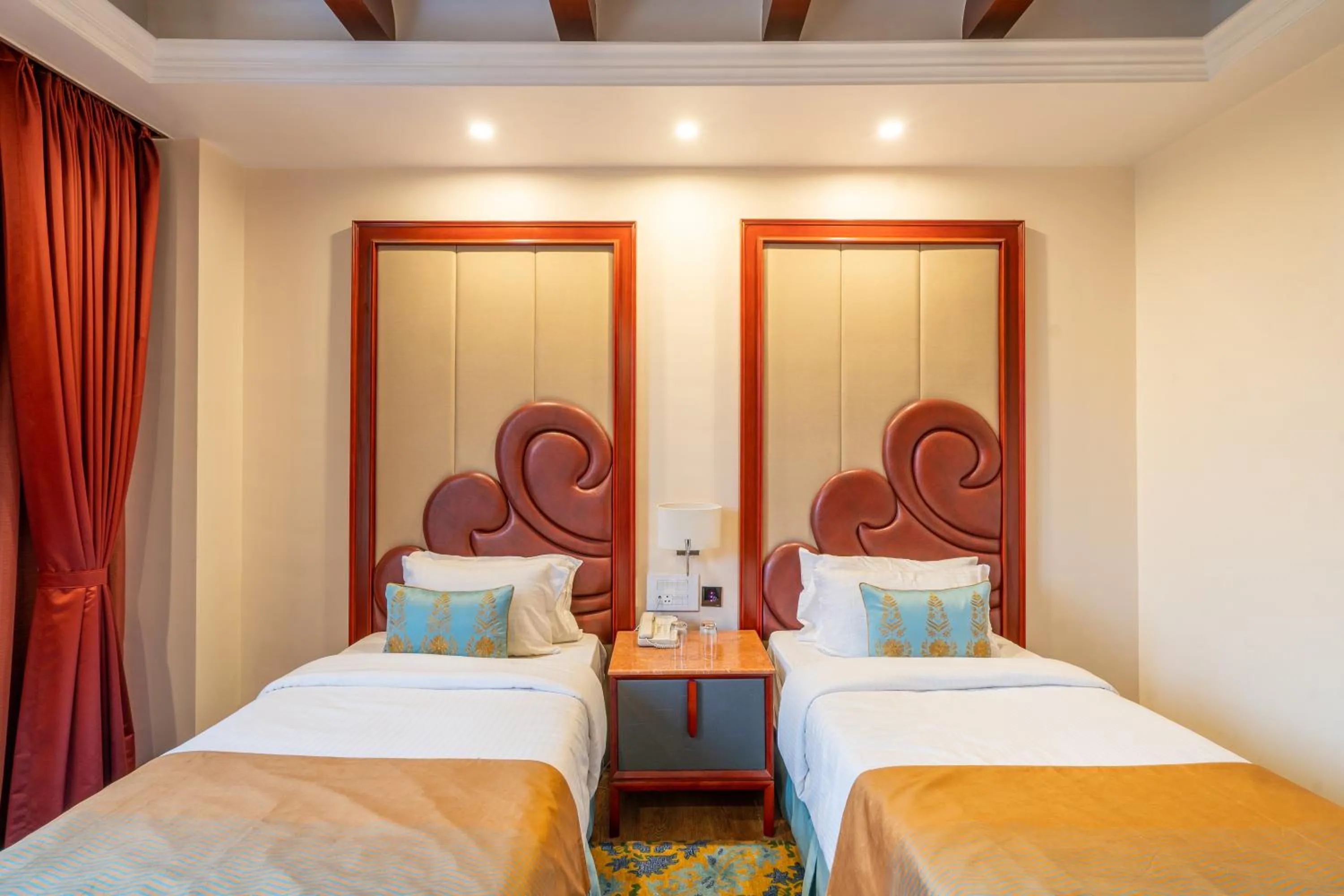 Bed in Hukam's Lalit Mahal - Hotel Convention Club