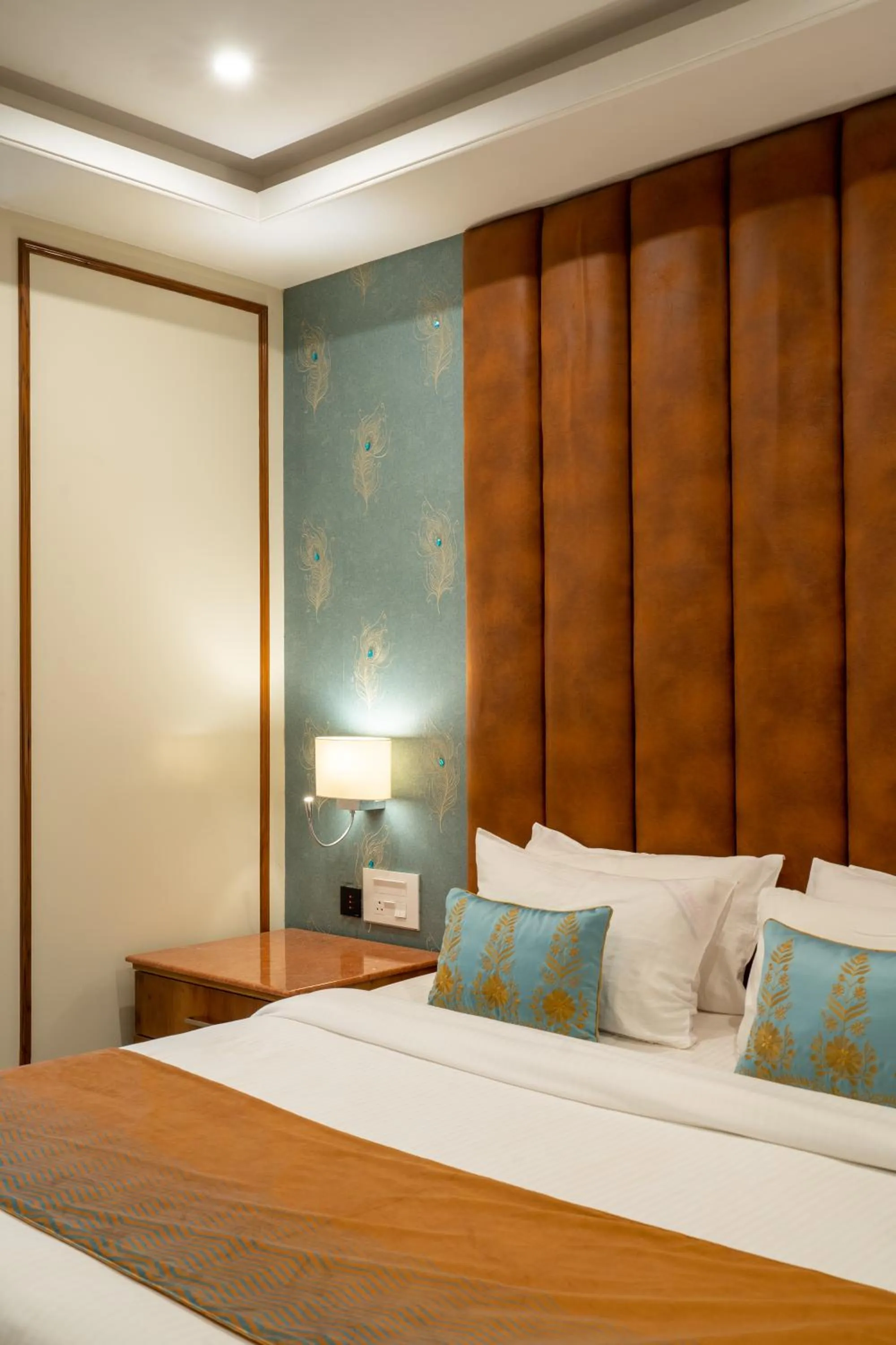 Bed in Hukam's Lalit Mahal - Hotel Convention Club