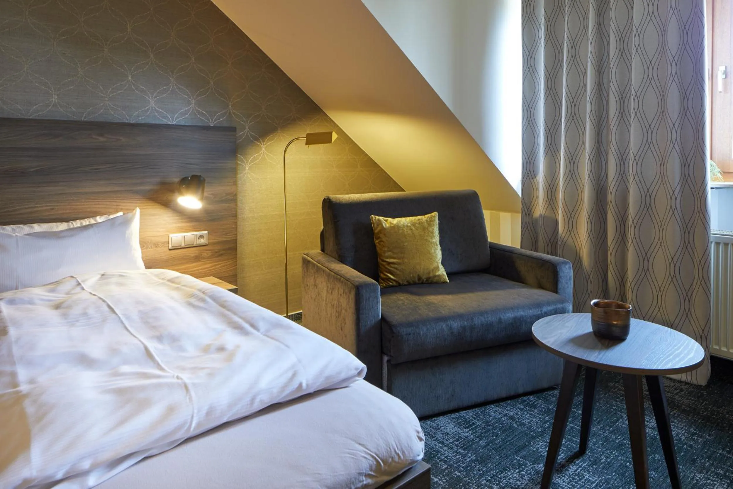 Seating area, Bed in NaturKulturHotel Stumpf