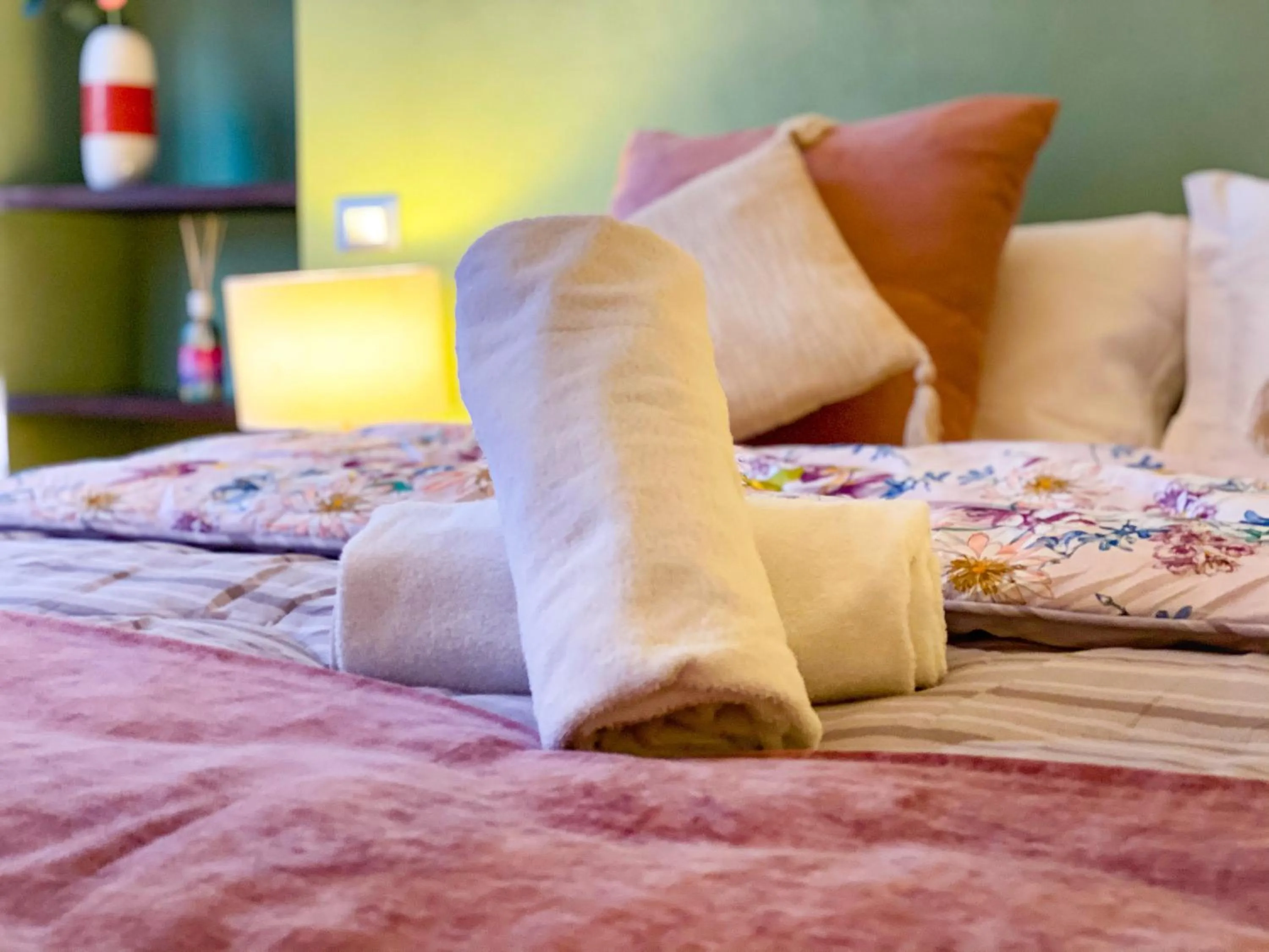 Bed in OROROSA Lucca City Center Apartment