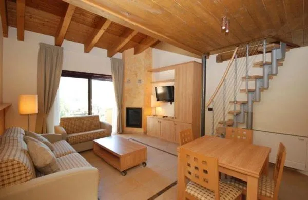 Communal lounge/ TV room in Tassido Coda Resort