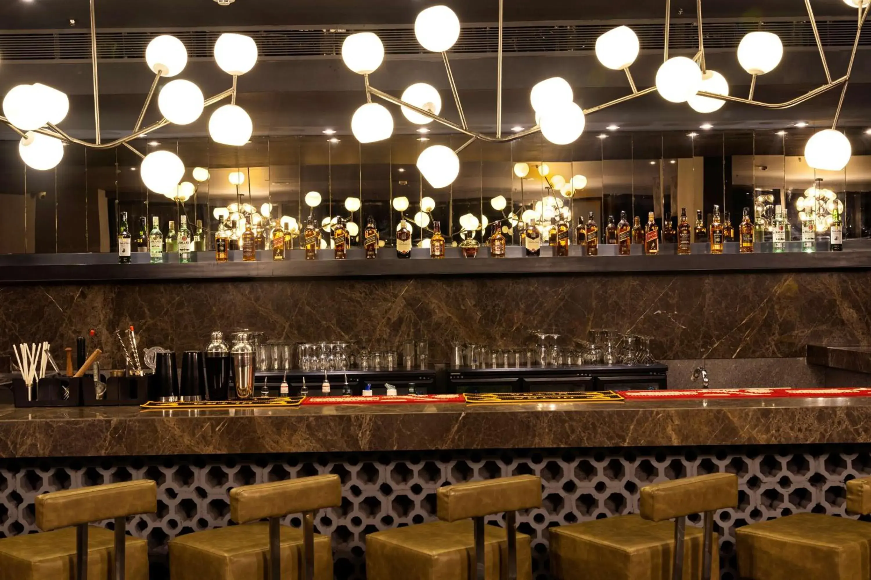 Lounge or bar in The Elite Narasapura, a member of Radisson Individuals Lounge or bar in The Elite Narasapura, a member of Radisson Individuals