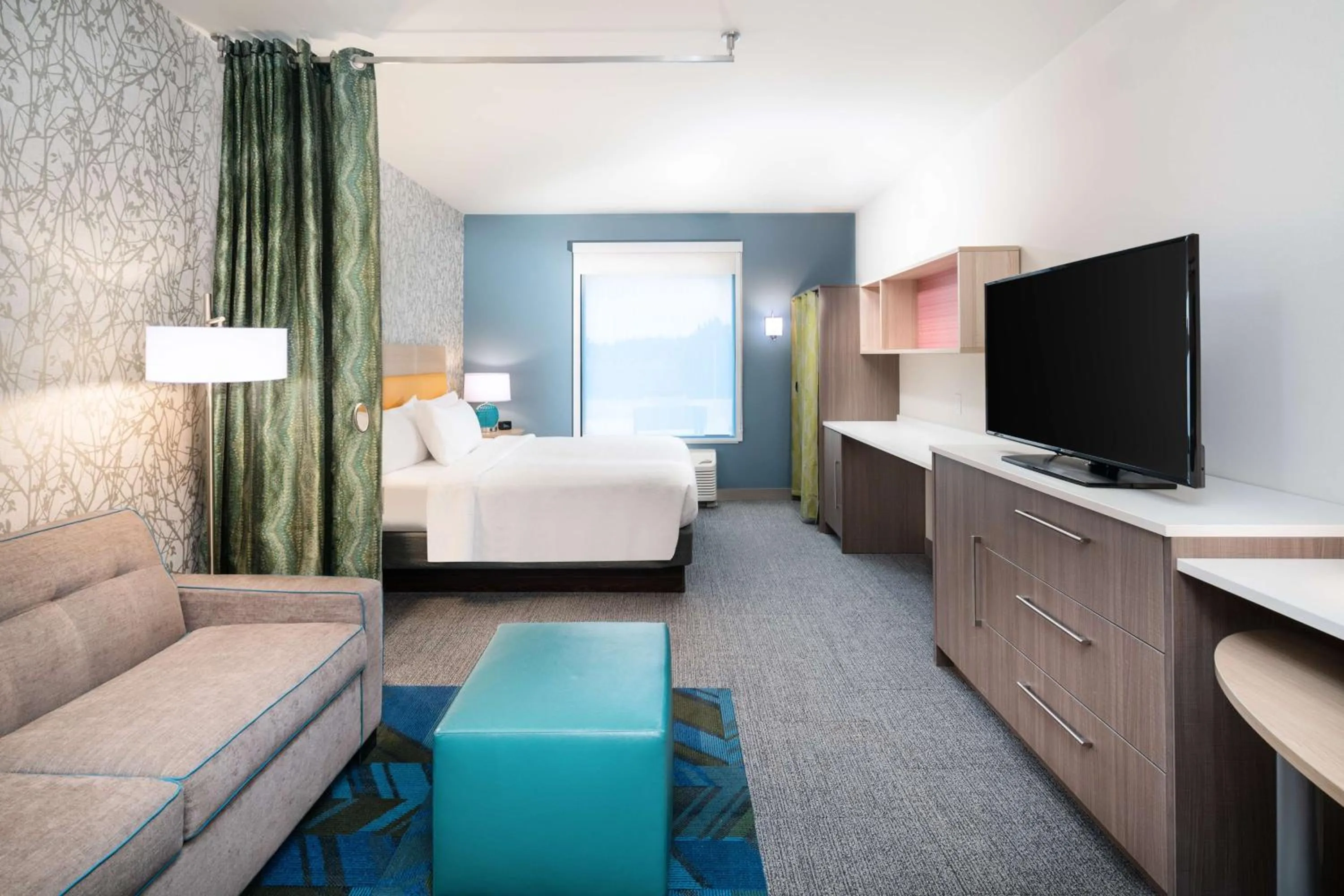 Living room, Bed in Home2 Suites By Hilton Brunswick