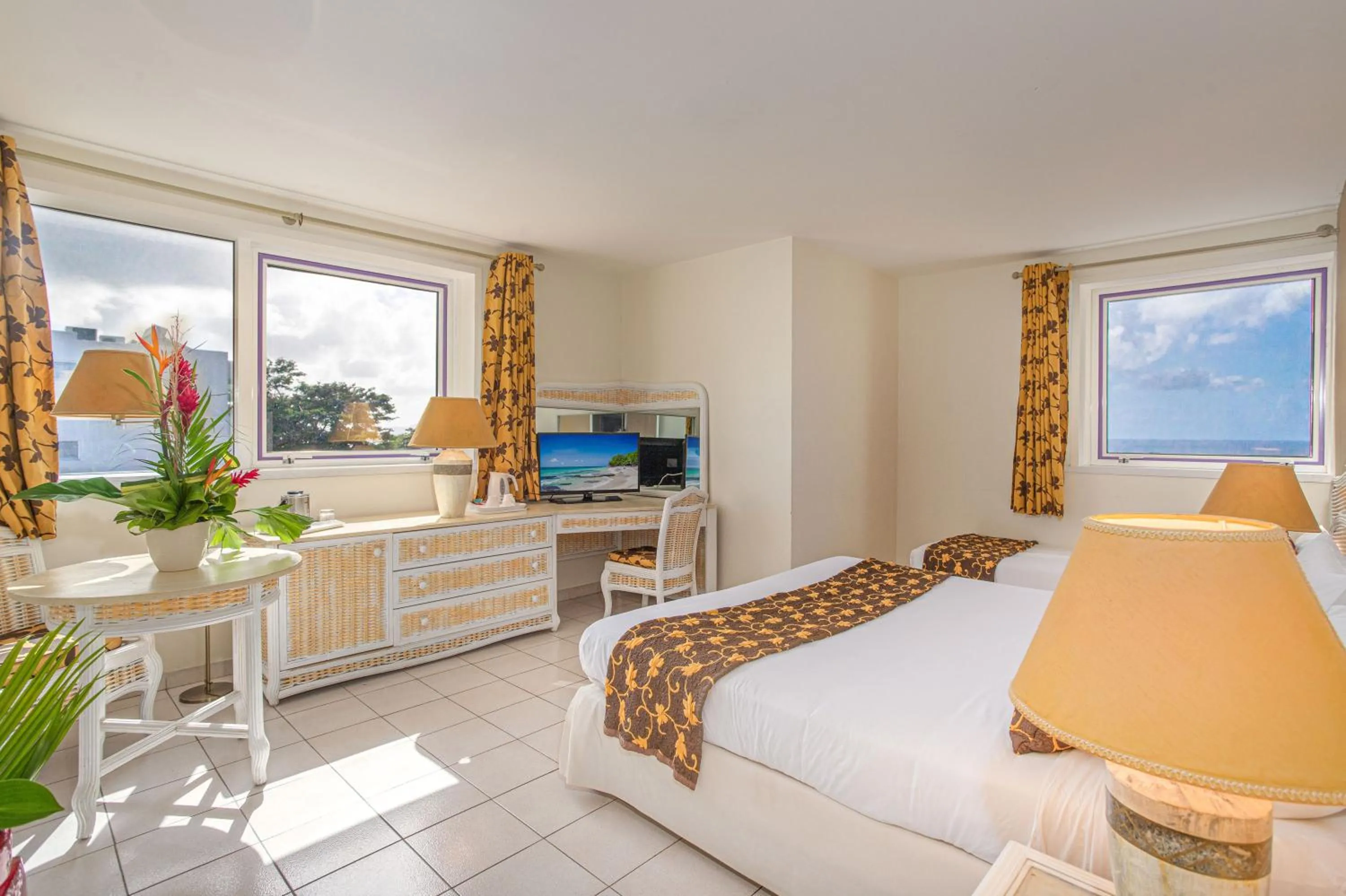 Bed in Karibea Squash Hôtel