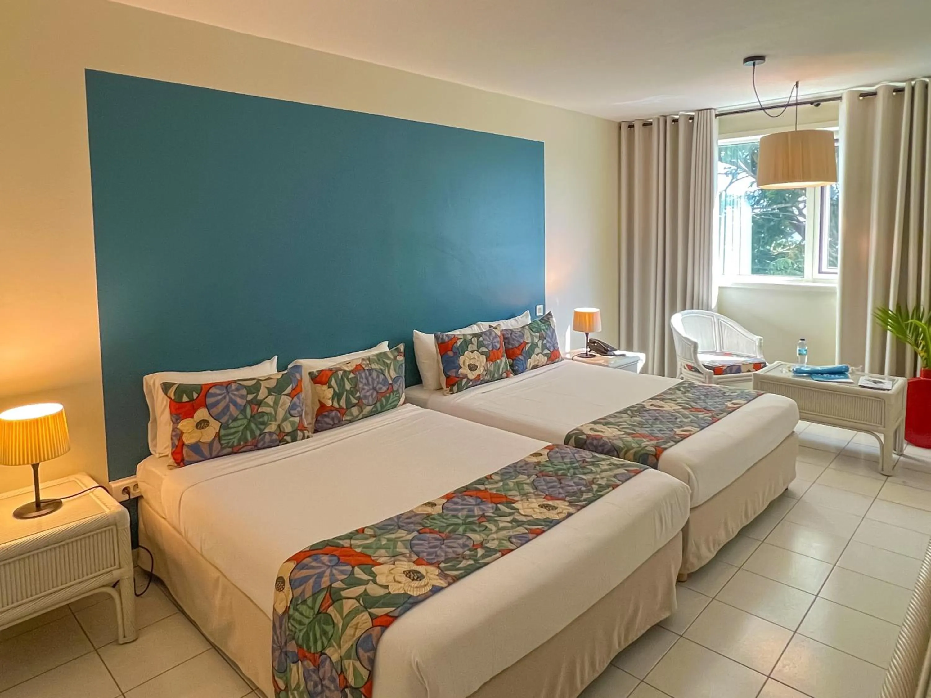 Bed in Karibea Squash Hôtel