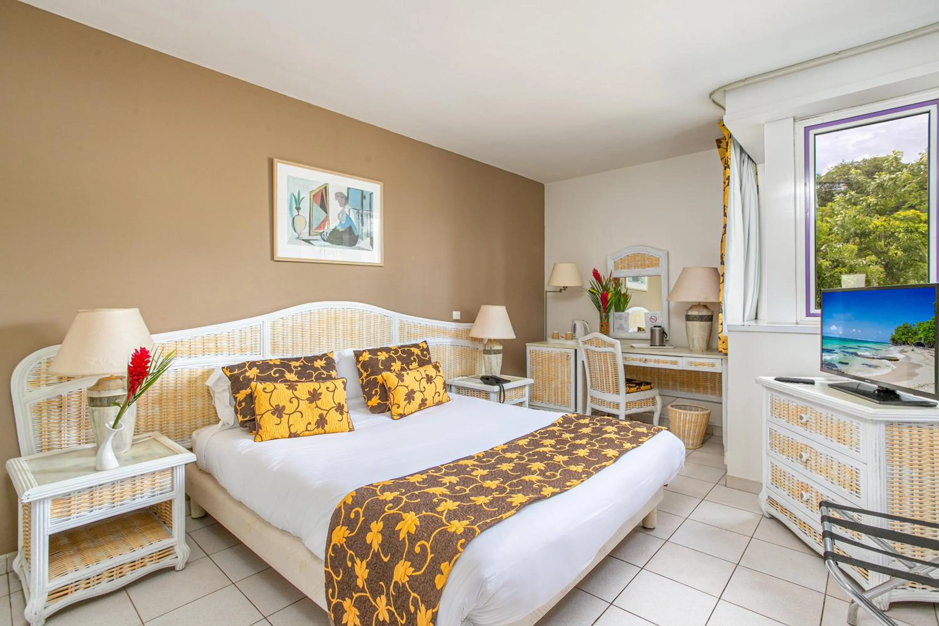 Bed in Karibea Squash Hôtel