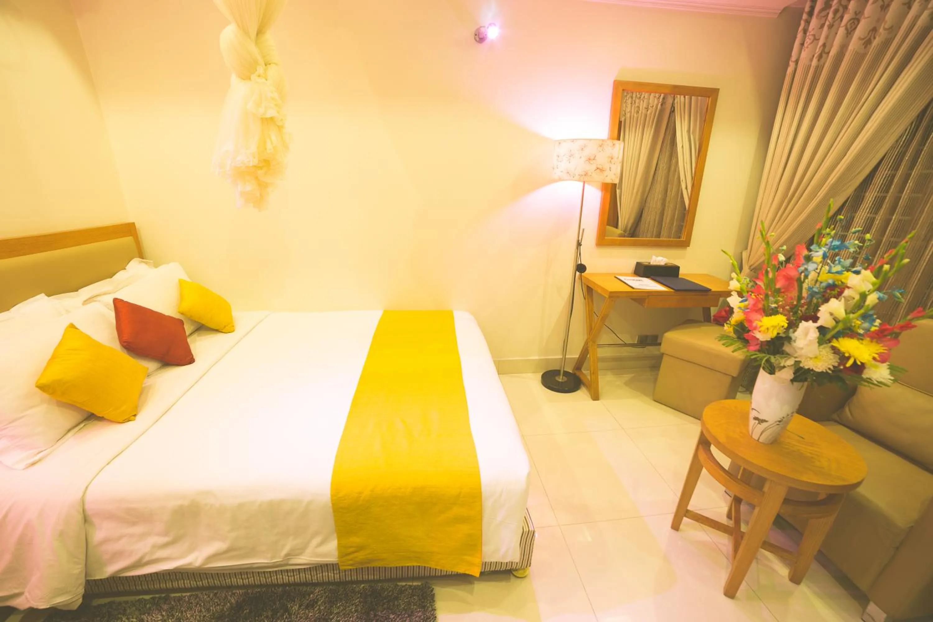 Bed in Nascent Gardenia Luxury Suites