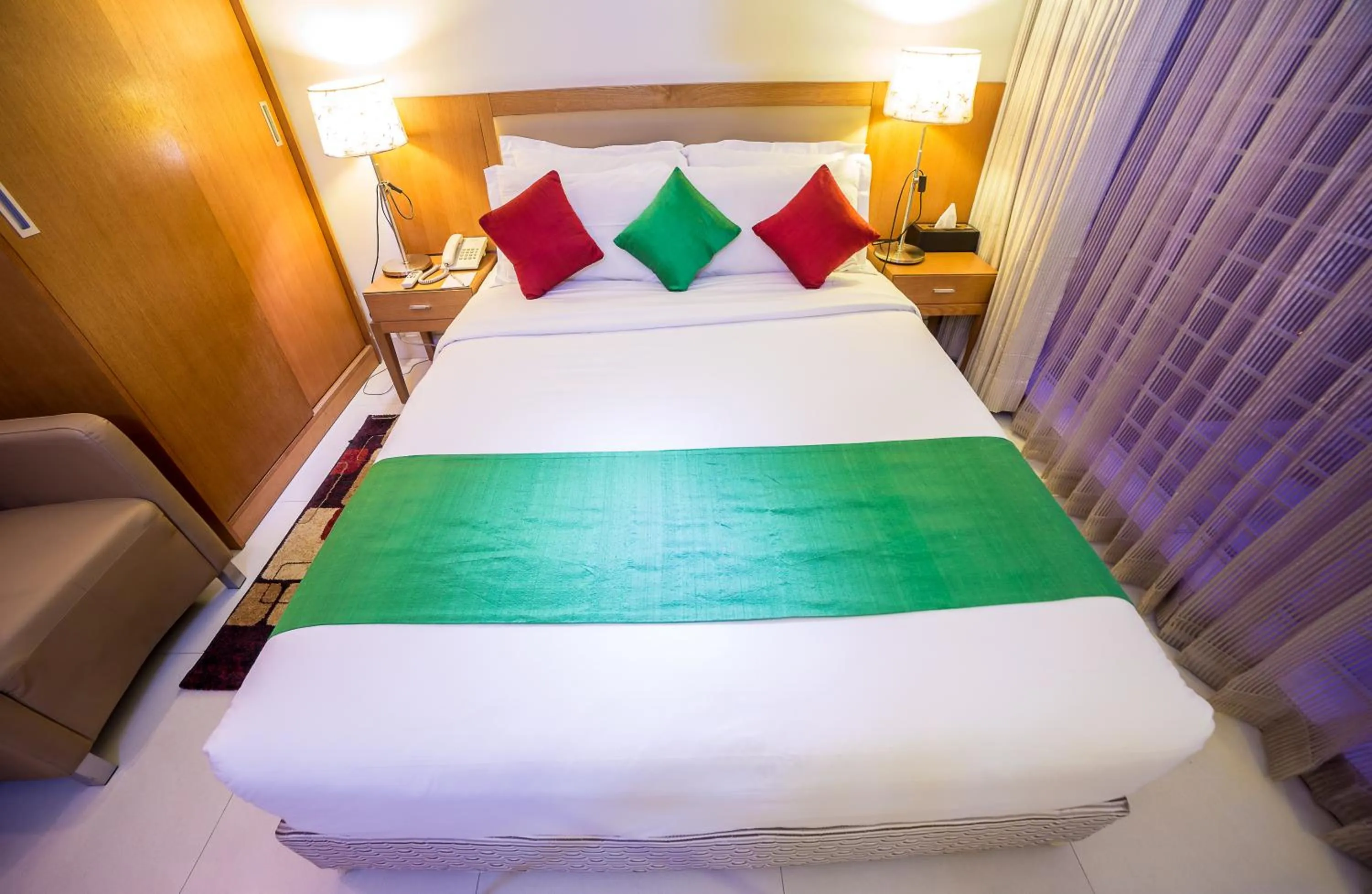 Bed in Nascent Gardenia Luxury Suites