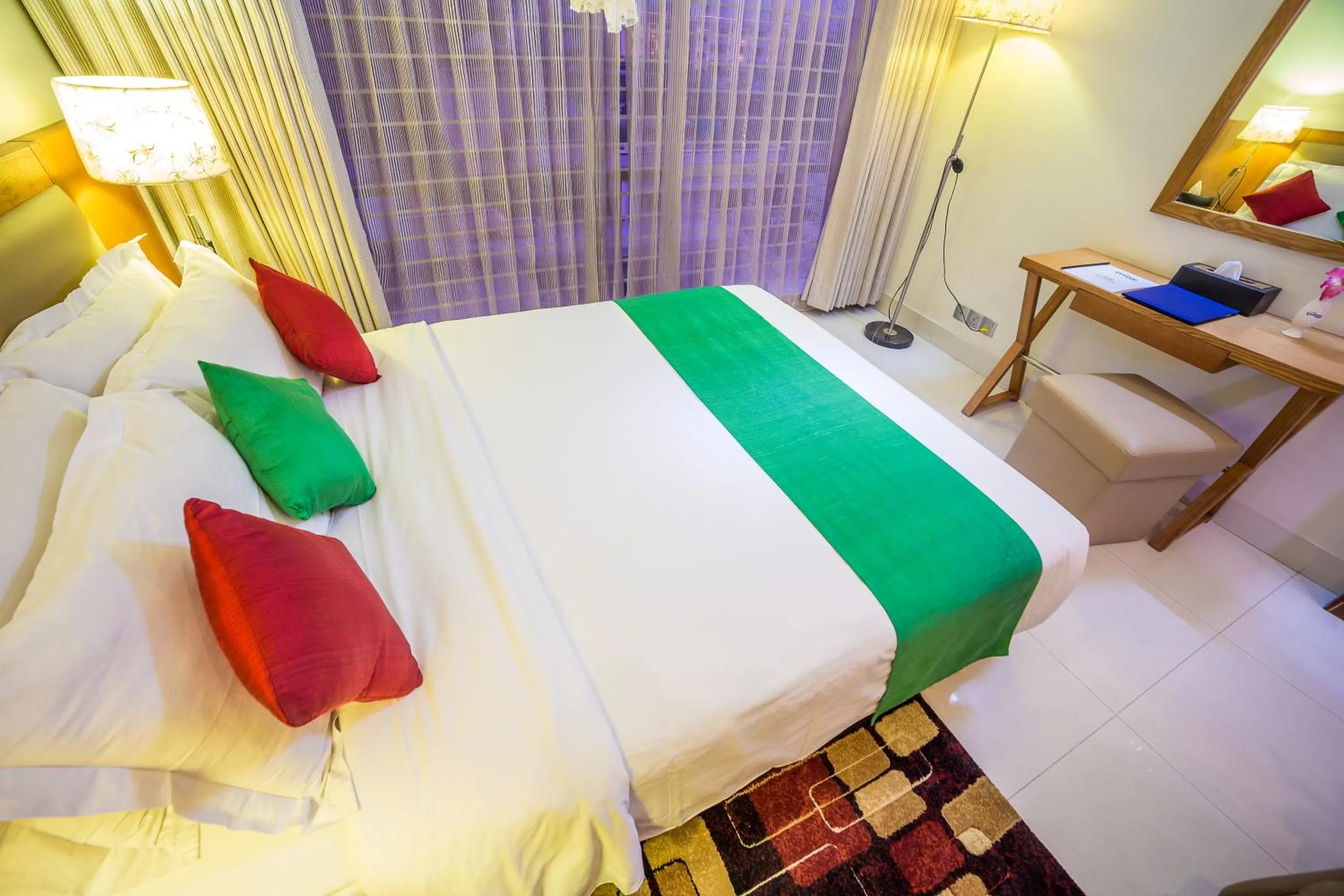 Bed in Nascent Gardenia Luxury Suites