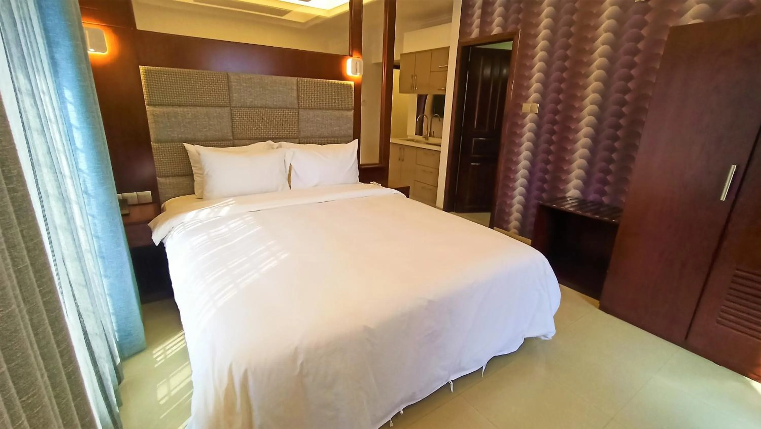 Bed in Nascent Gardenia Luxury Suites