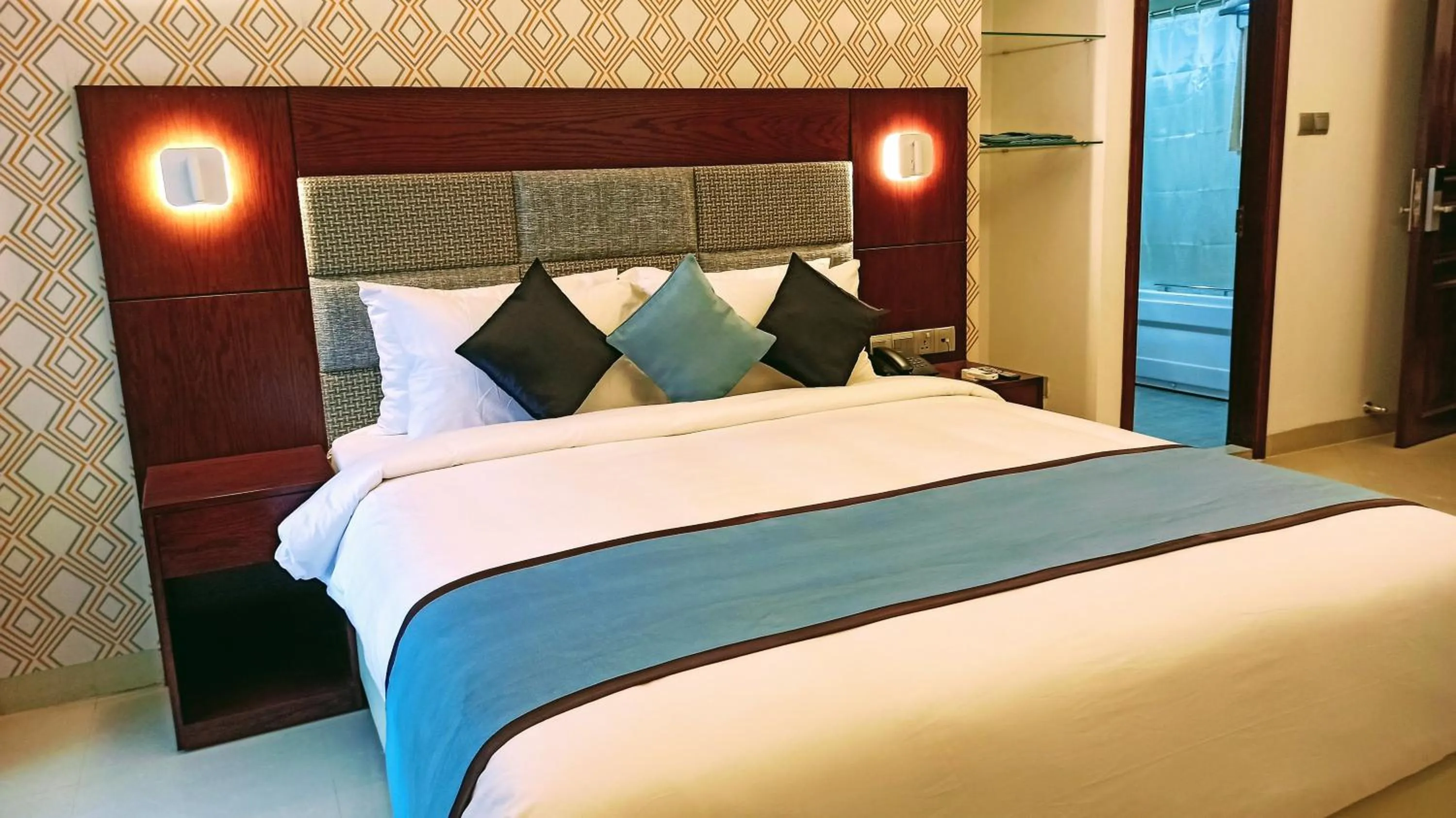 Bed in Nascent Gardenia Luxury Suites