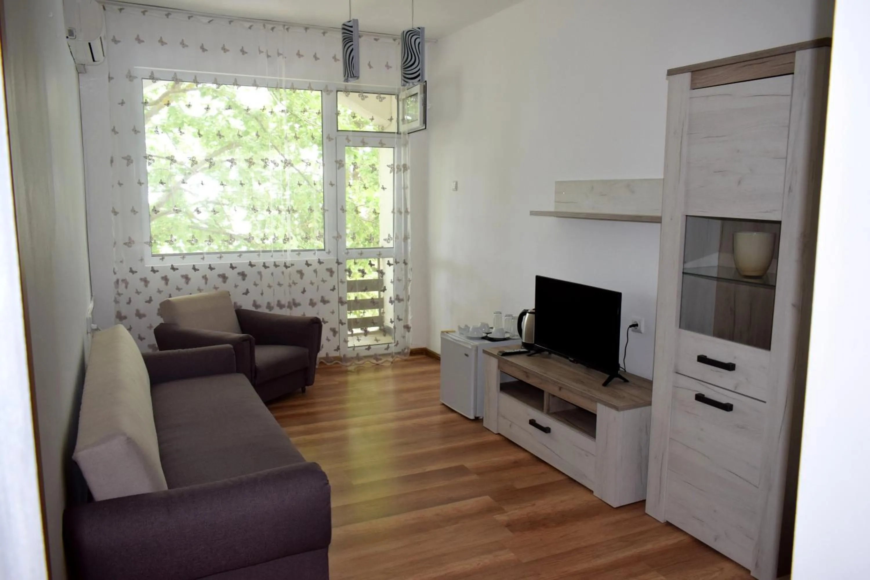 Living room in Ahilea Hotel - Free Pool Access