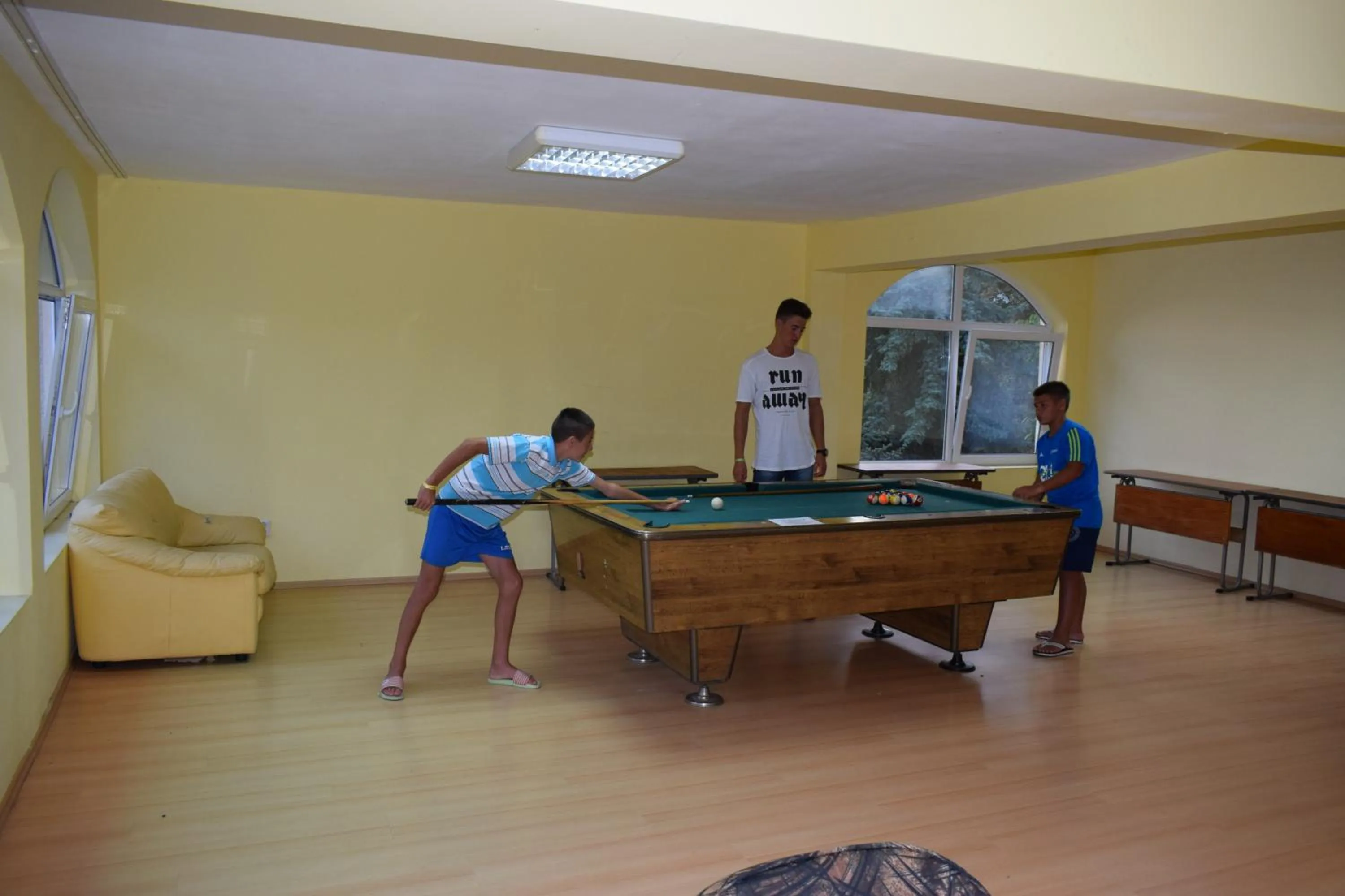 People in Ahilea Hotel - Free Pool Access