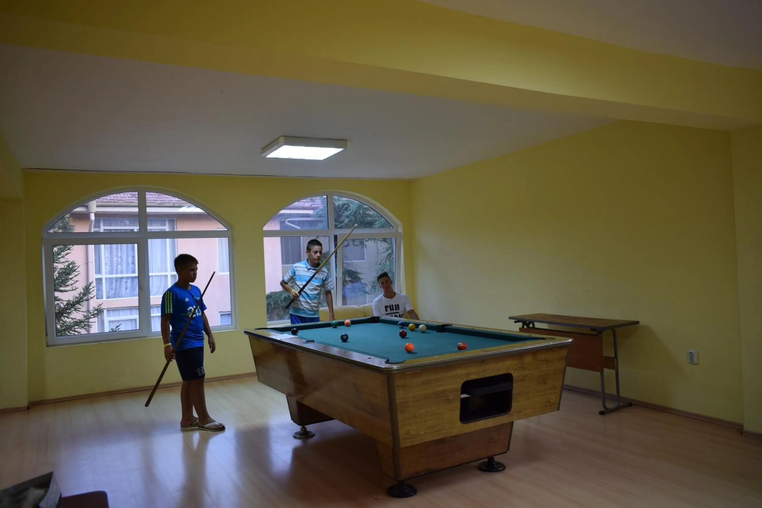 People in Ahilea Hotel - Free Pool Access