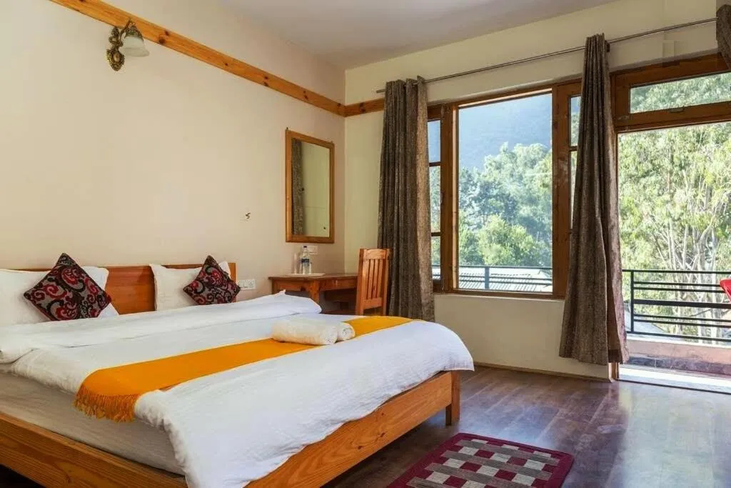 Bed in Tirthan Grand Riverside