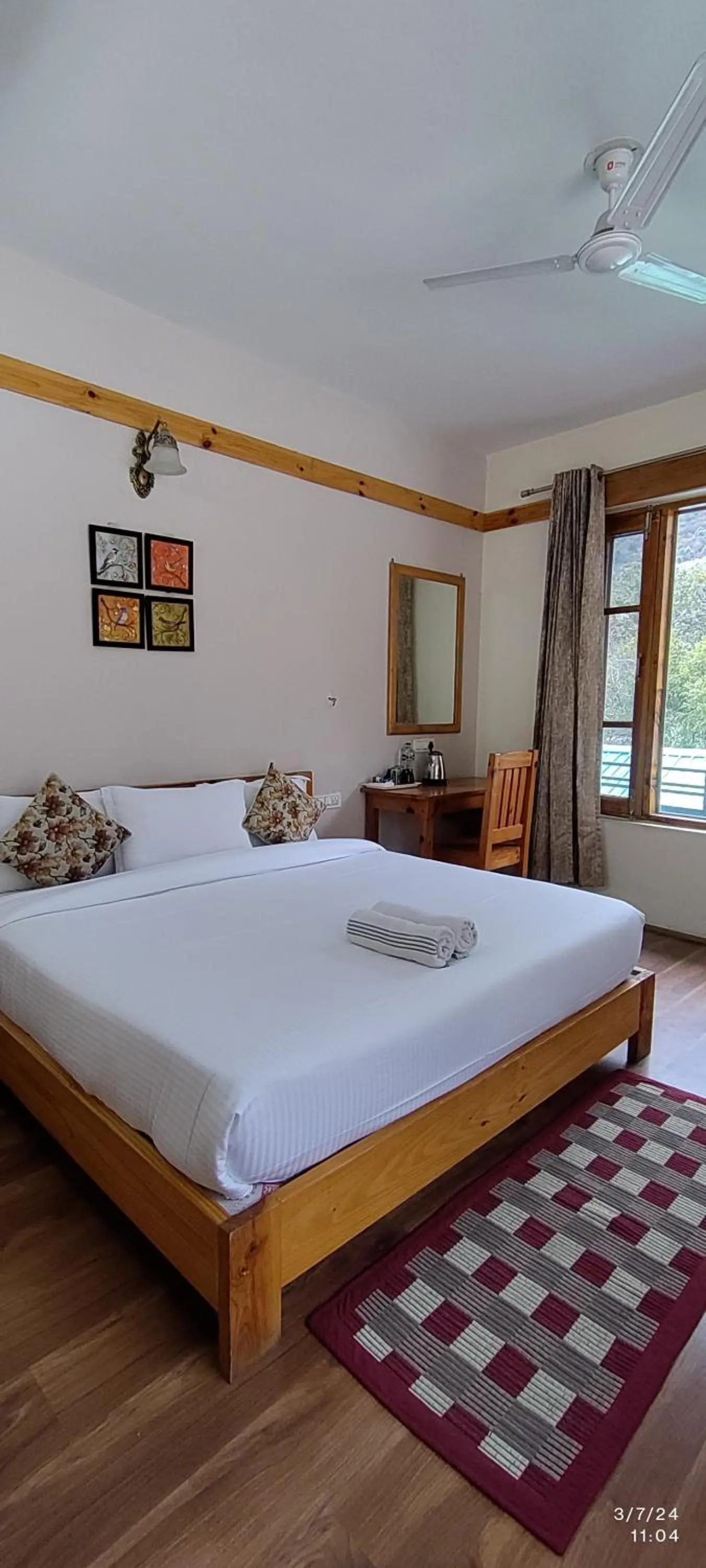 Bed in Tirthan Grand Riverside