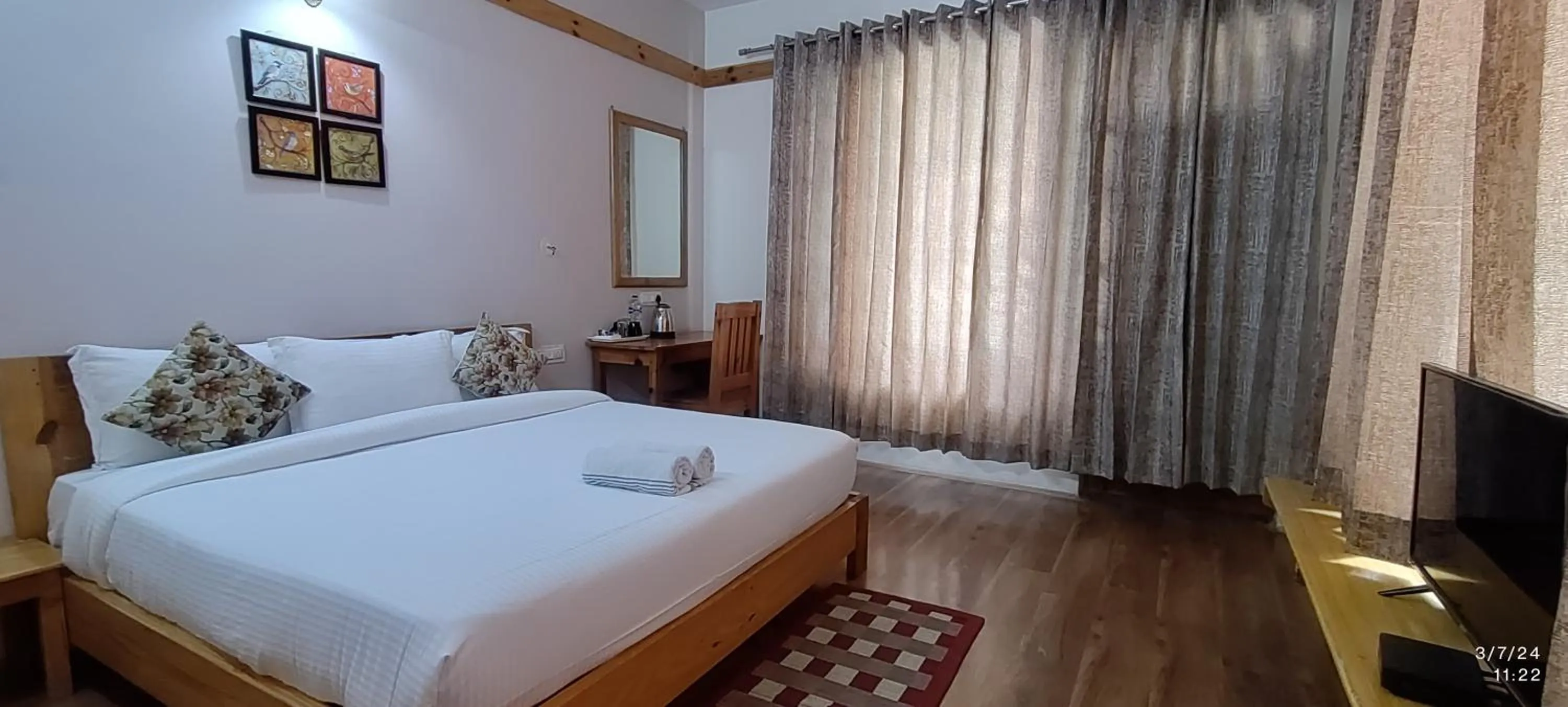 Bed in Tirthan Grand Riverside