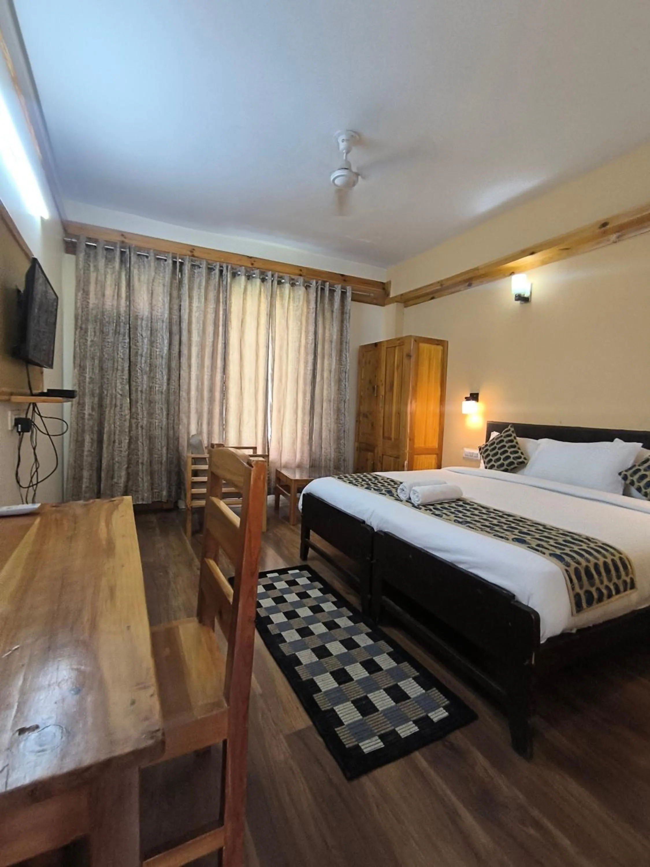 Bed in Tirthan Grand Riverside