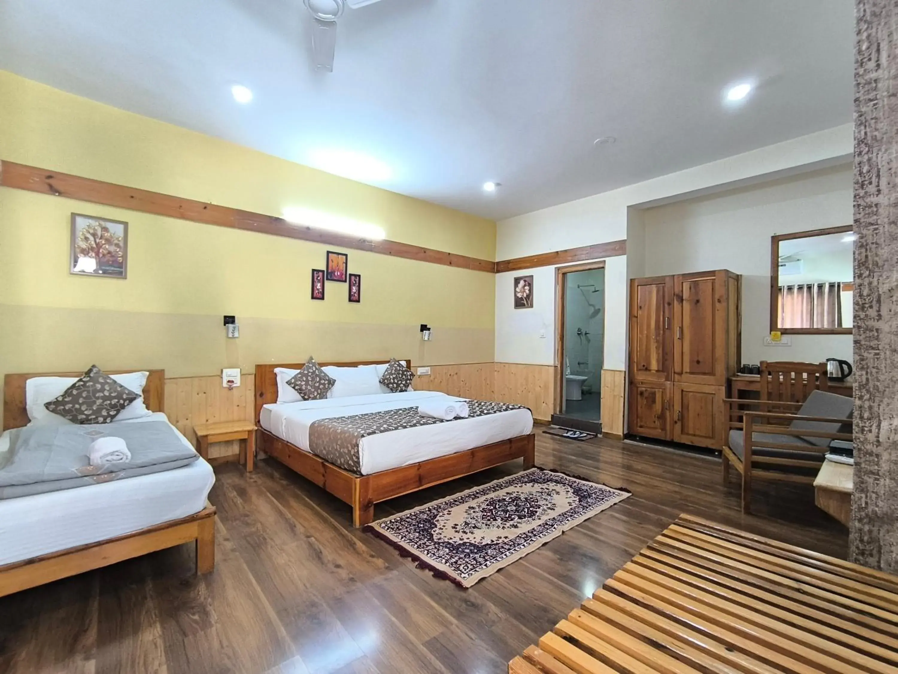 Deluxe Triple Room in Tirthan Grand Riverside Deluxe Triple Room in Tirthan Grand Riverside