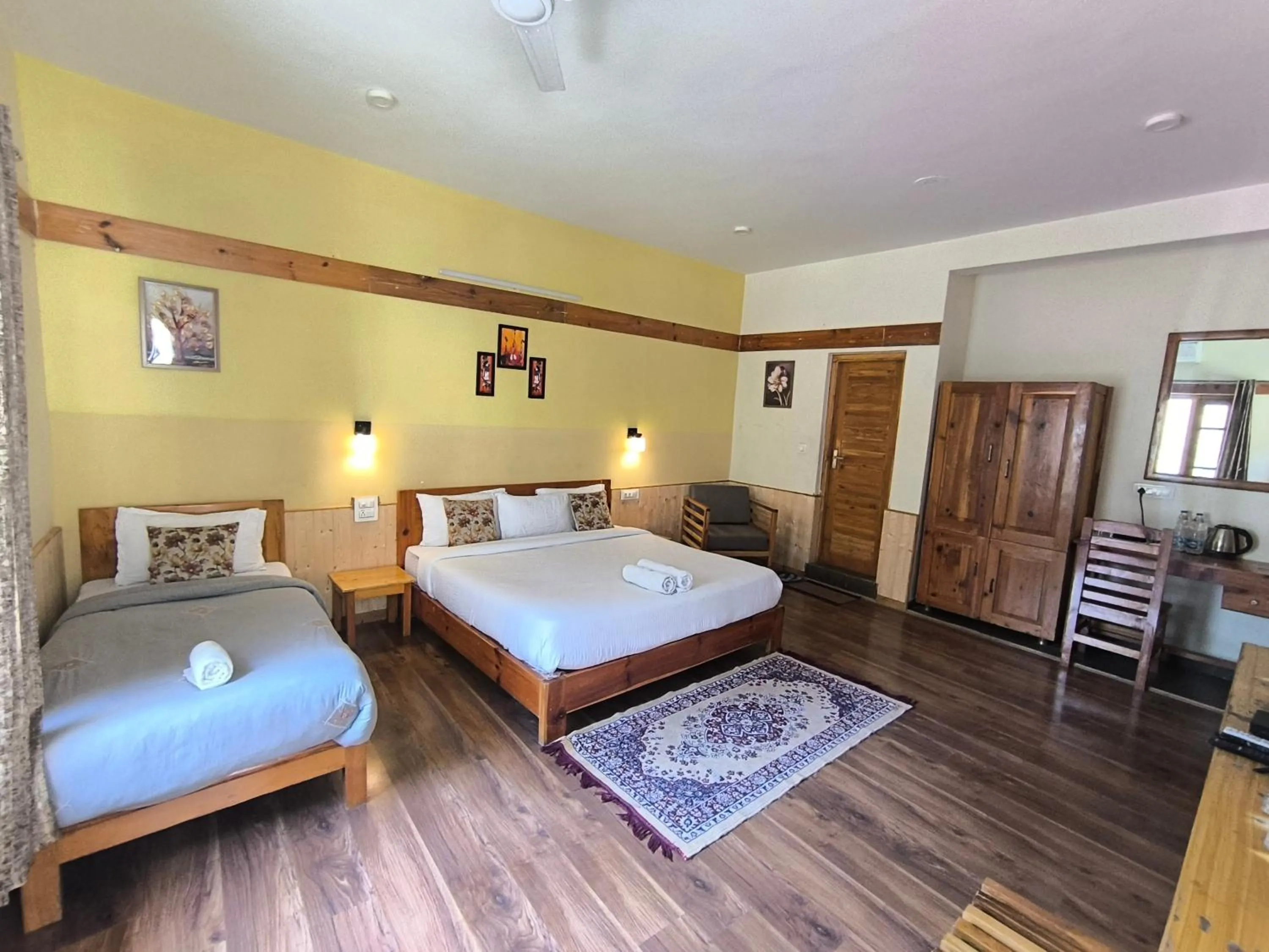 Bed in Tirthan Grand Riverside