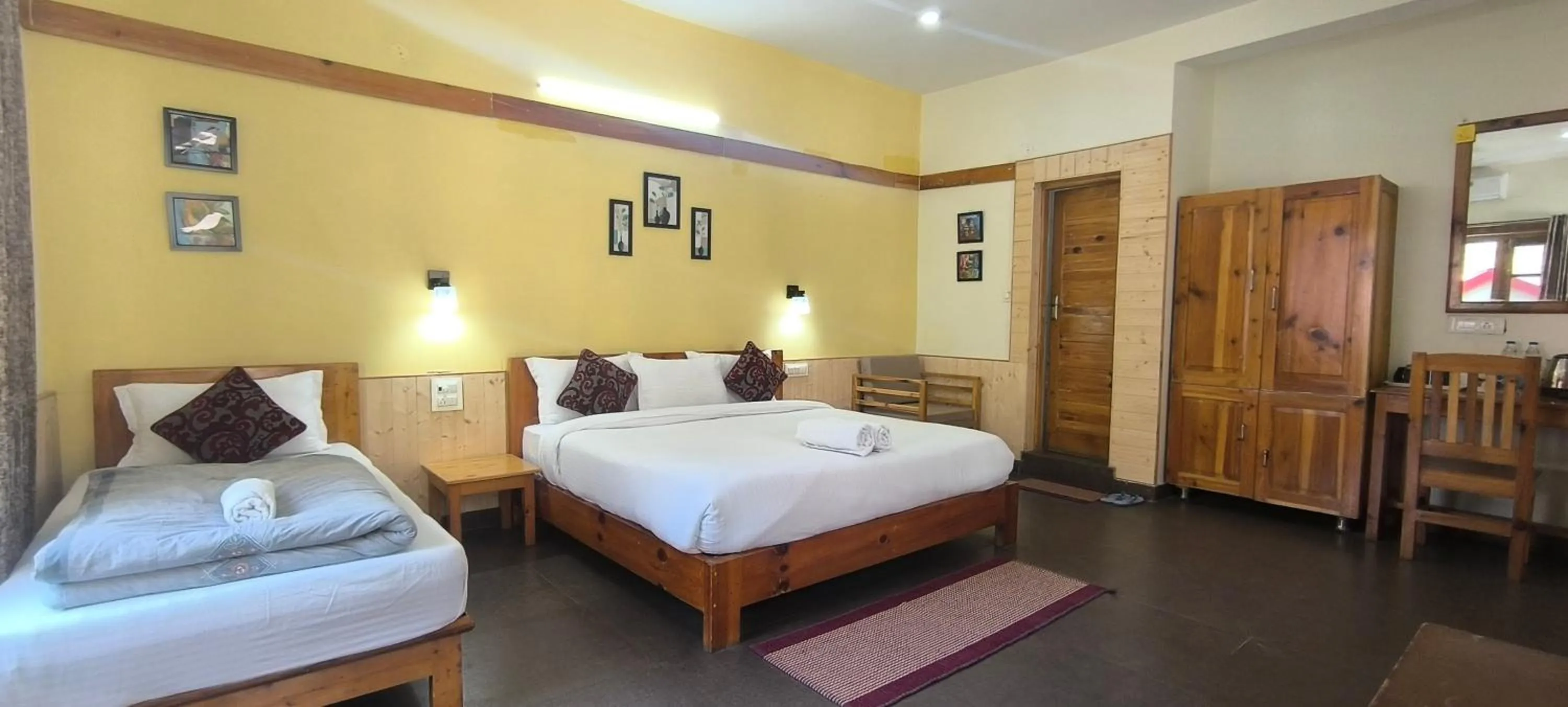 Bed in Tirthan Grand Riverside