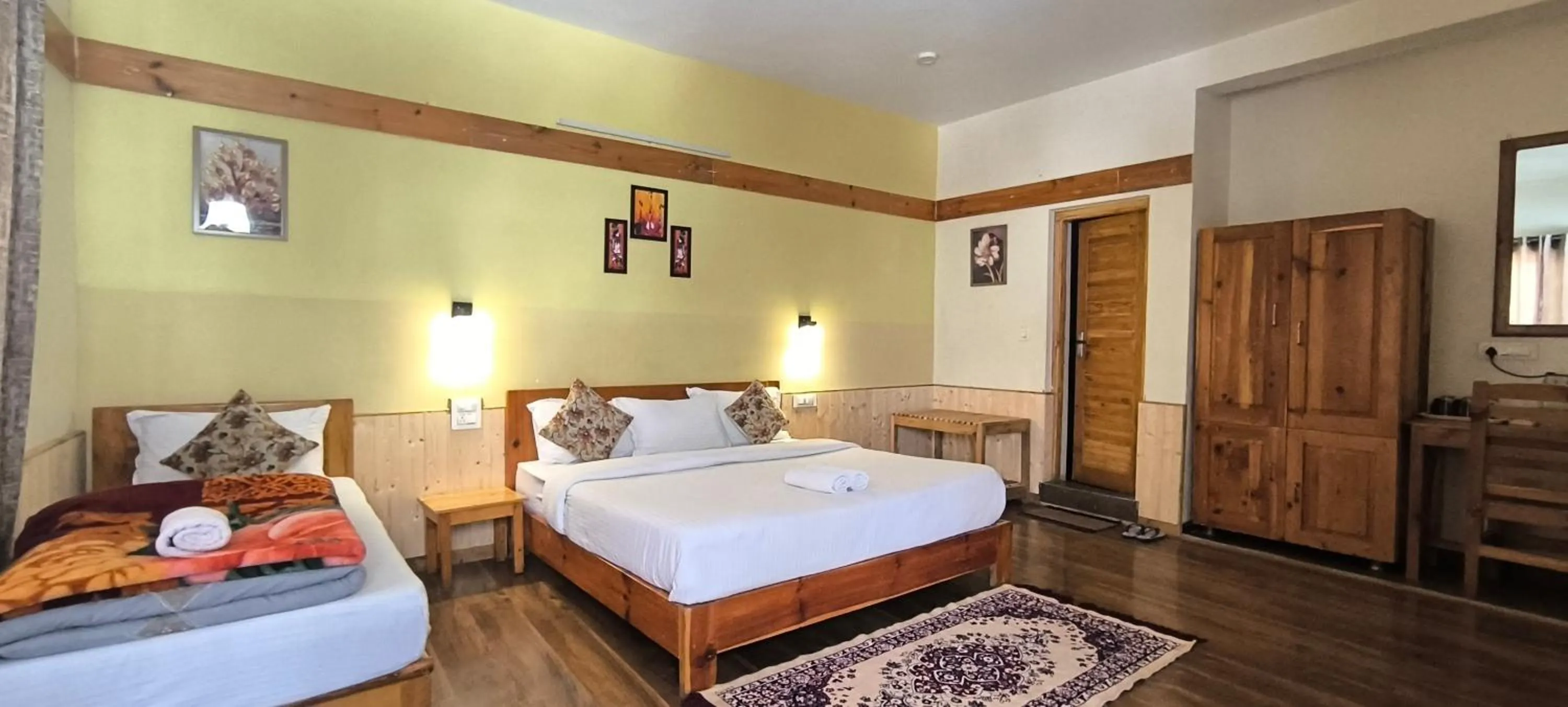 Bed in Tirthan Grand Riverside