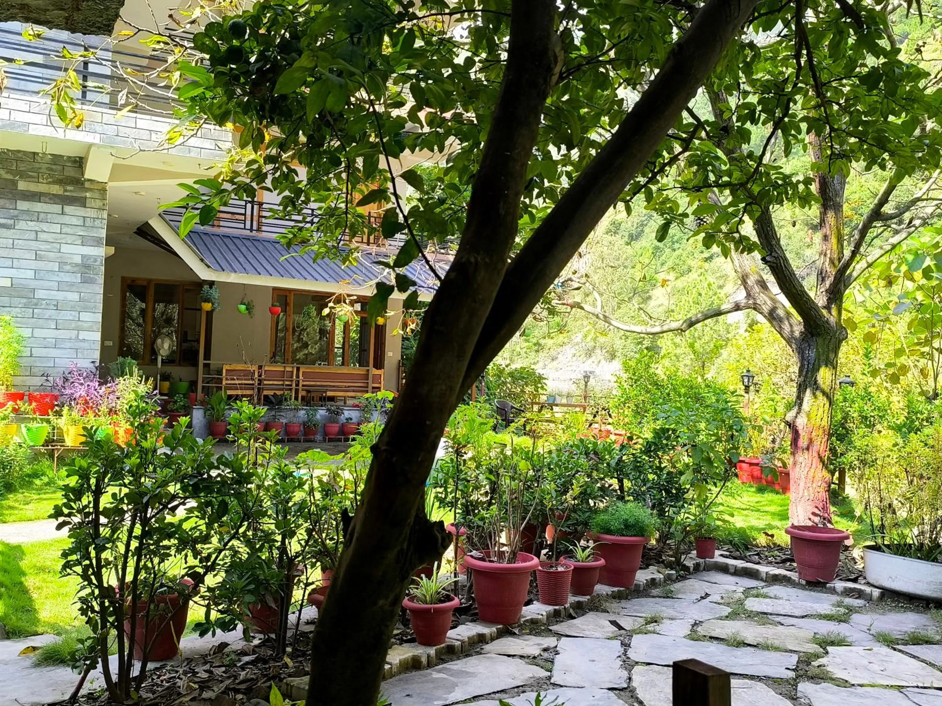 Patio in Tirthan Grand Riverside