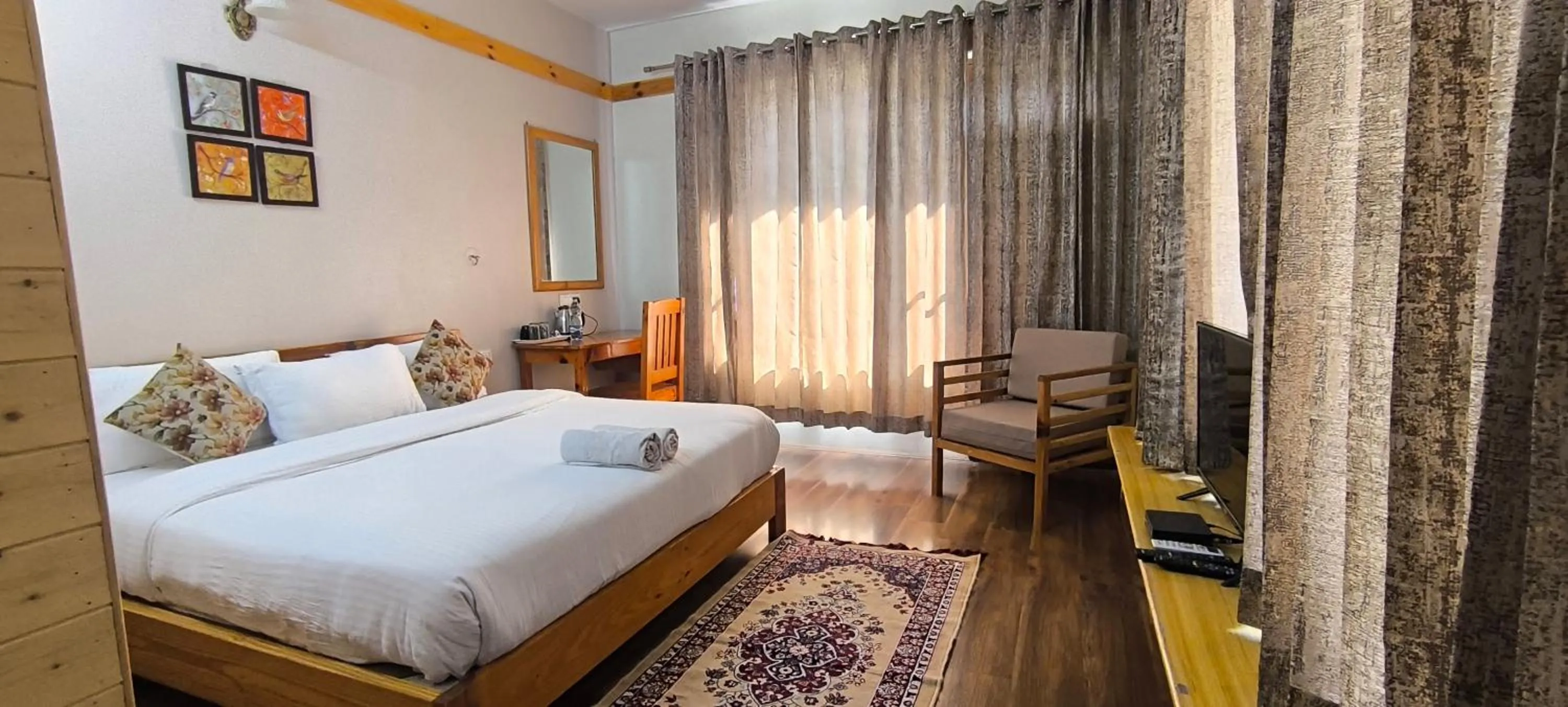 Bed in Tirthan Grand Riverside