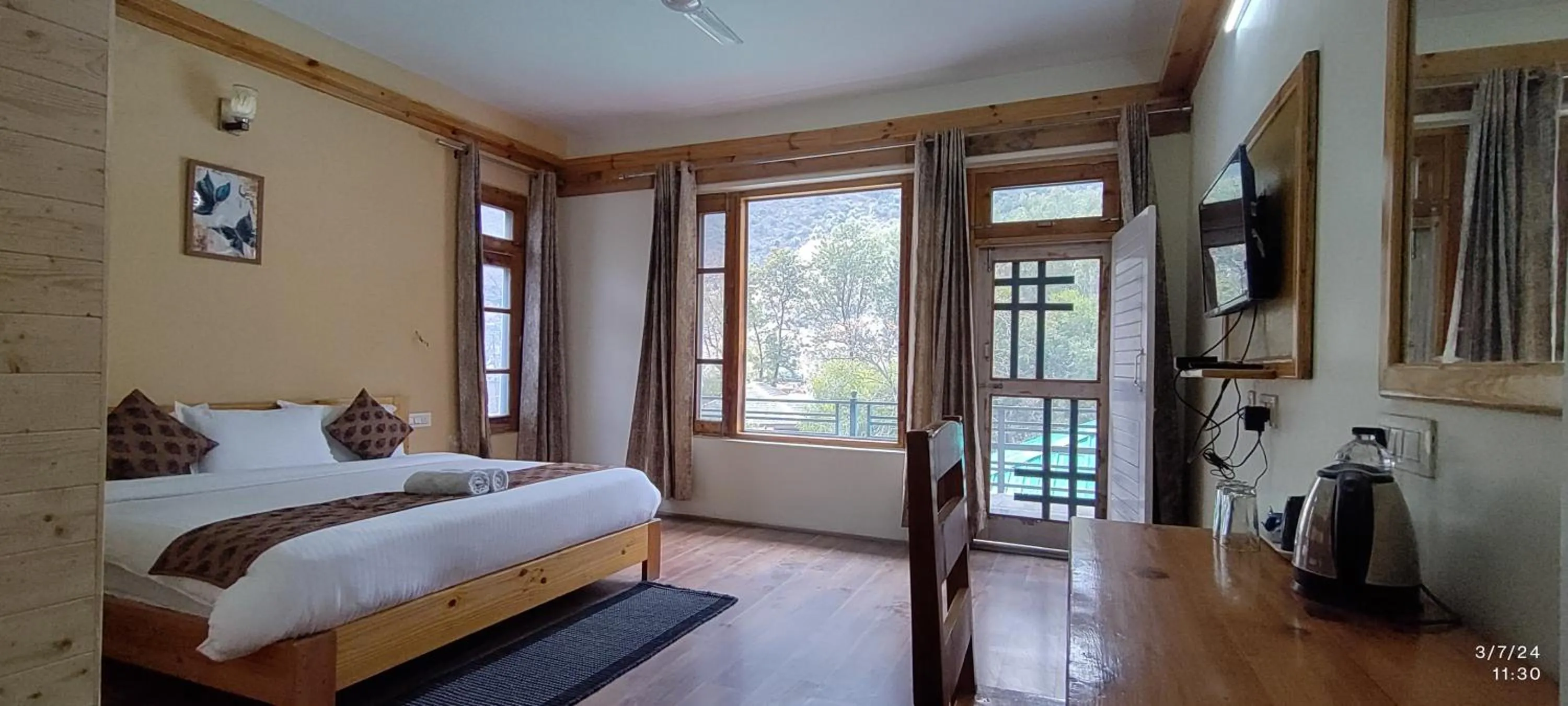 Bed in Tirthan Grand Riverside