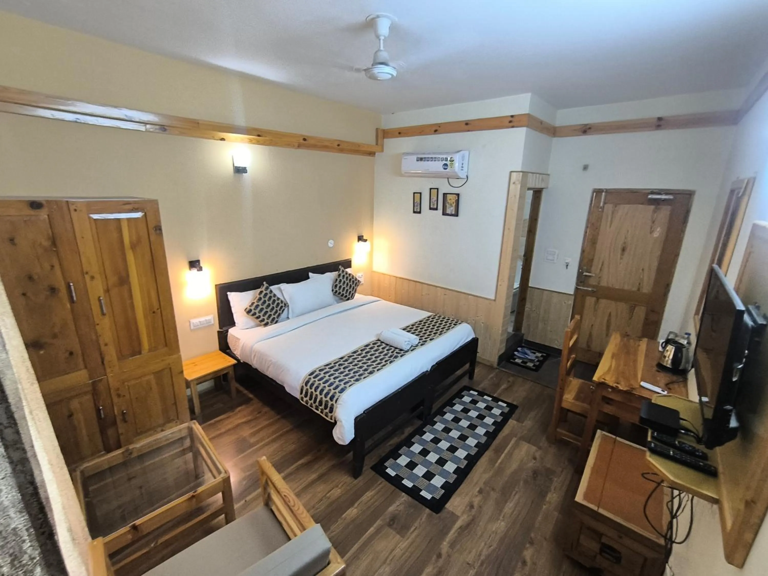 Bed in Tirthan Grand Riverside