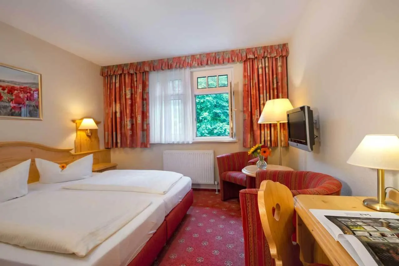 Photo of the whole room, Bed in Kurpark Flair Hotel Im Ilsetal