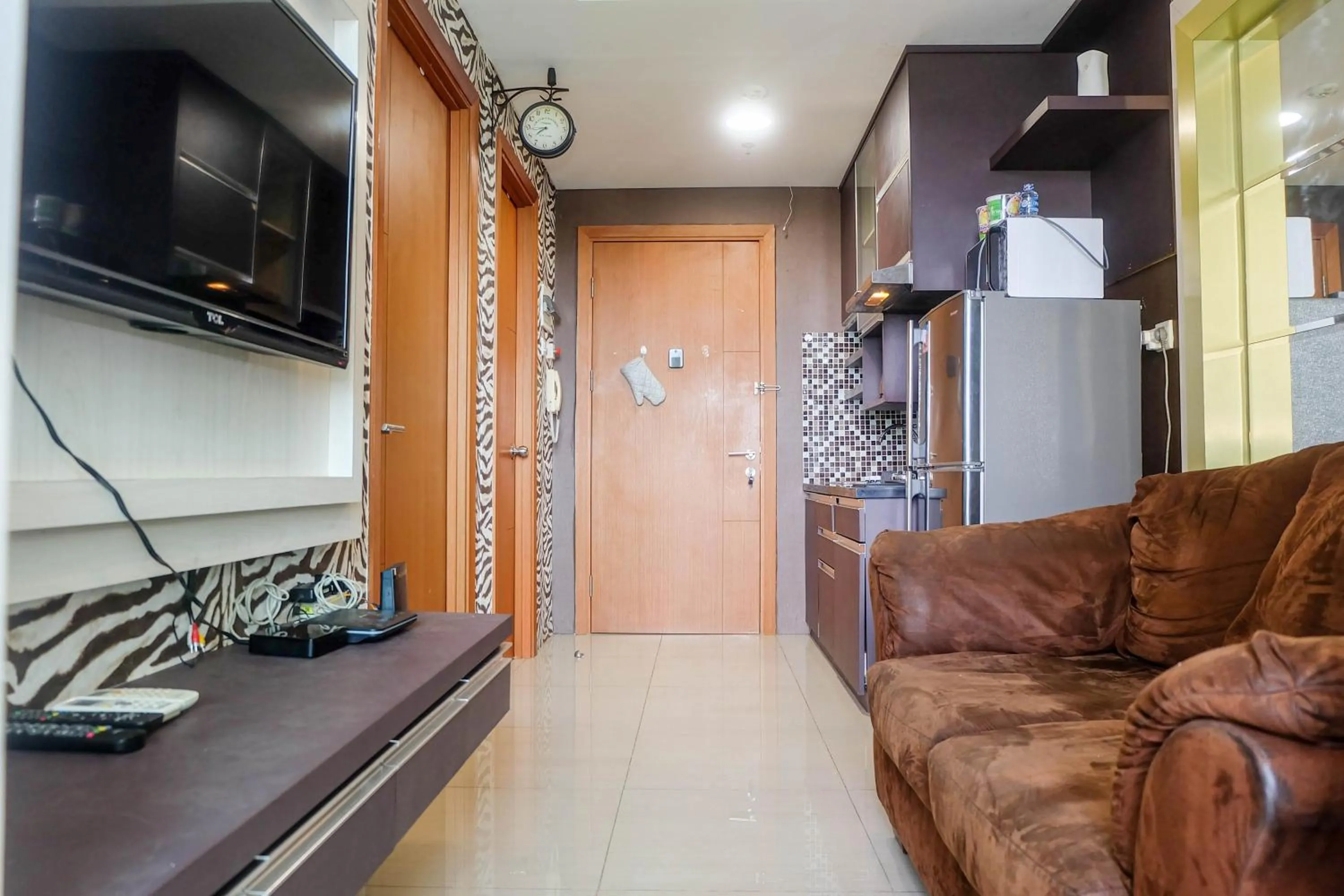 Photo of the whole room in Good Location with Simply Furnished 1BR Apartment Woodland Park Residence By Travelio