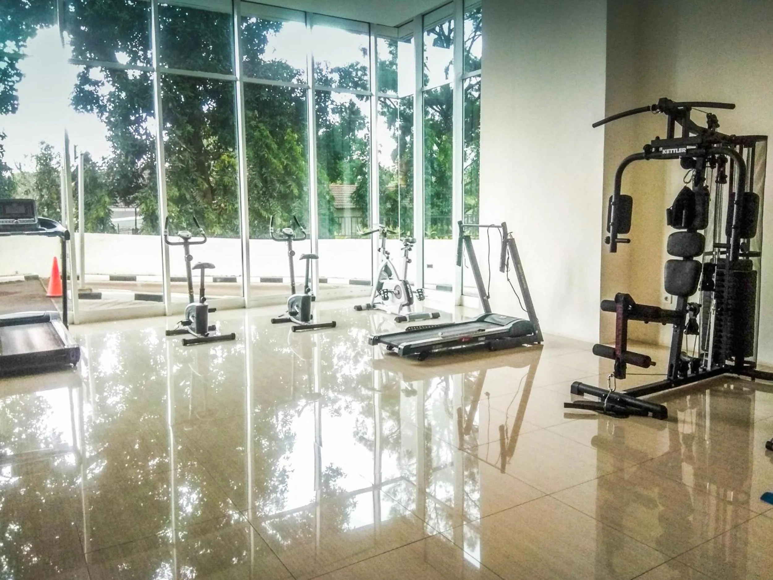 Fitness centre/facilities in Good Location with Simply Furnished 1BR Apartment Woodland Park Residence By Travelio